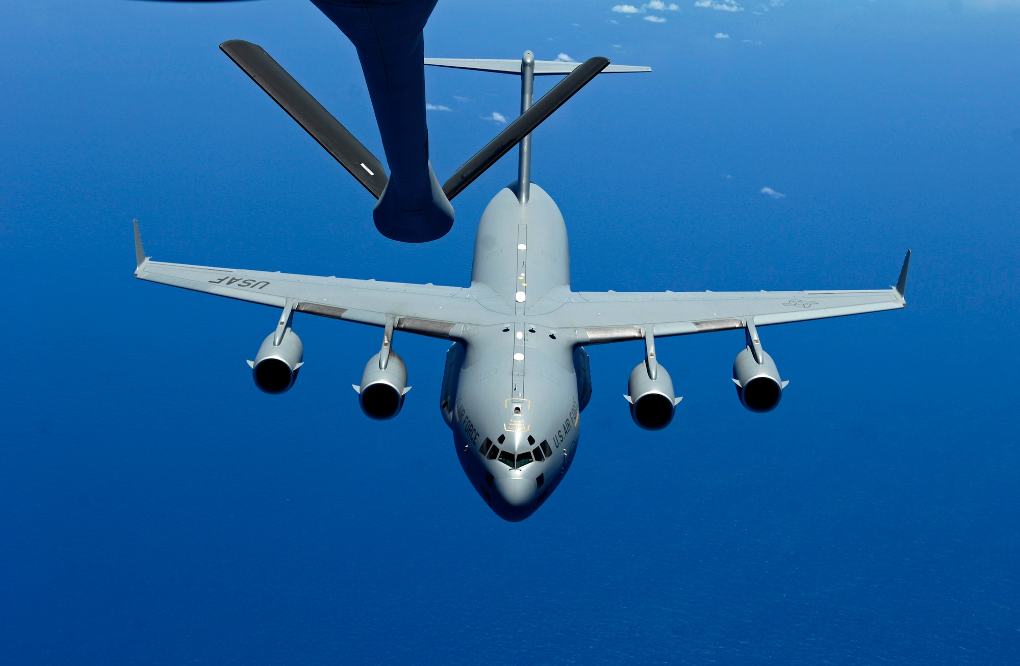A C-17 Globemaster III approaches the boom of a KC-135 Stratotanker June 18 during aerial refueling practice. A KC-135 Stratotanker from the 909th Air Refueling Squadron, at Kadena Air Base, Japan is at Hickam Air Force Base, Hawaii, practicing with a C-17 Globemaster III from the 535th Airlift Squadron for the Air Mobility Command Rodeo. (U.S. Air Force photo/Tech. Sgt. Shane A. Cuomo)