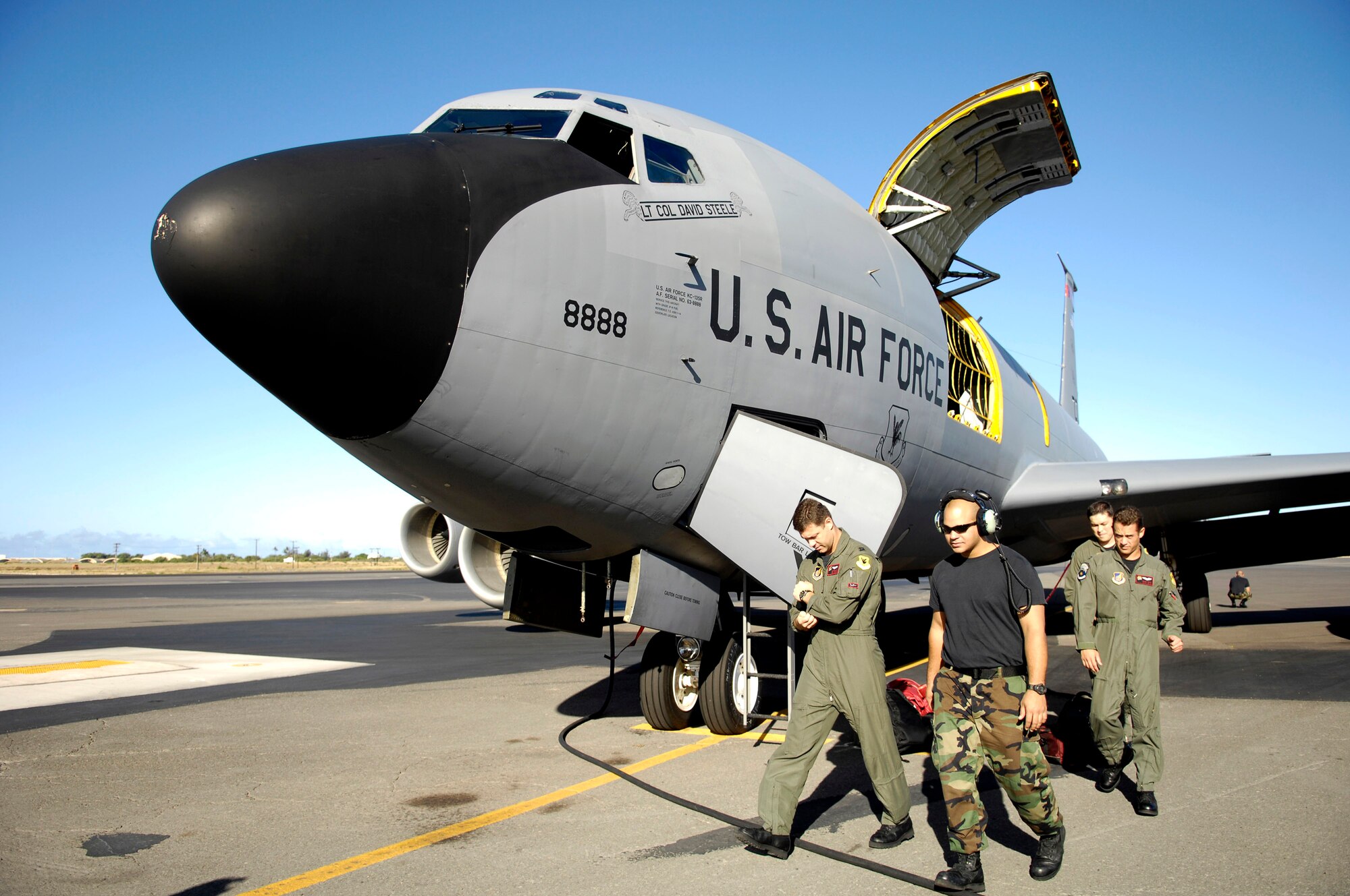Aircrew and maintenance personnel prepare to launch for a refueling mission June 18 from Hickam Air Force Base, Hawaii. A KC-135 Stratotanker crew from the 18th Wing at Kadena Air Base, Japan is at Hickam AFB practicing with a C-17 Globemaster III from the 535th Airlift Squadron for the Air Mobility Command Rodeo. The Airmen are with the 909th Air Refueling Squadron. (U.S. Air Force photo/Tech. Sgt. Shane A. Cuomo) 