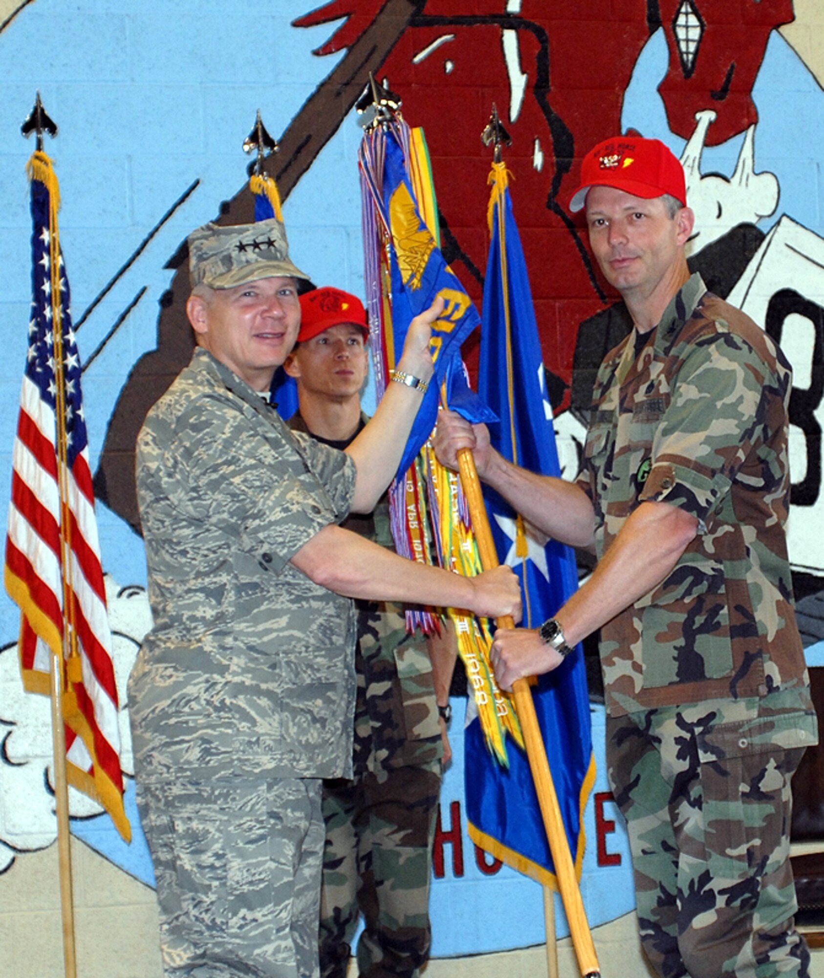 Col. Terry Watkins accepts command of the 819th RED HORSE Squadron from Lt. Gen. Robert Elder, 8th Air Force commander, in a change of command ceremony held Wednesday at building 1460. Colonel Watkins comes to Malmstrom following a one-year stay at Carlisle Barracks where he was a student at the Army War College.  (U.S. Air Force photo/Christy Mason)