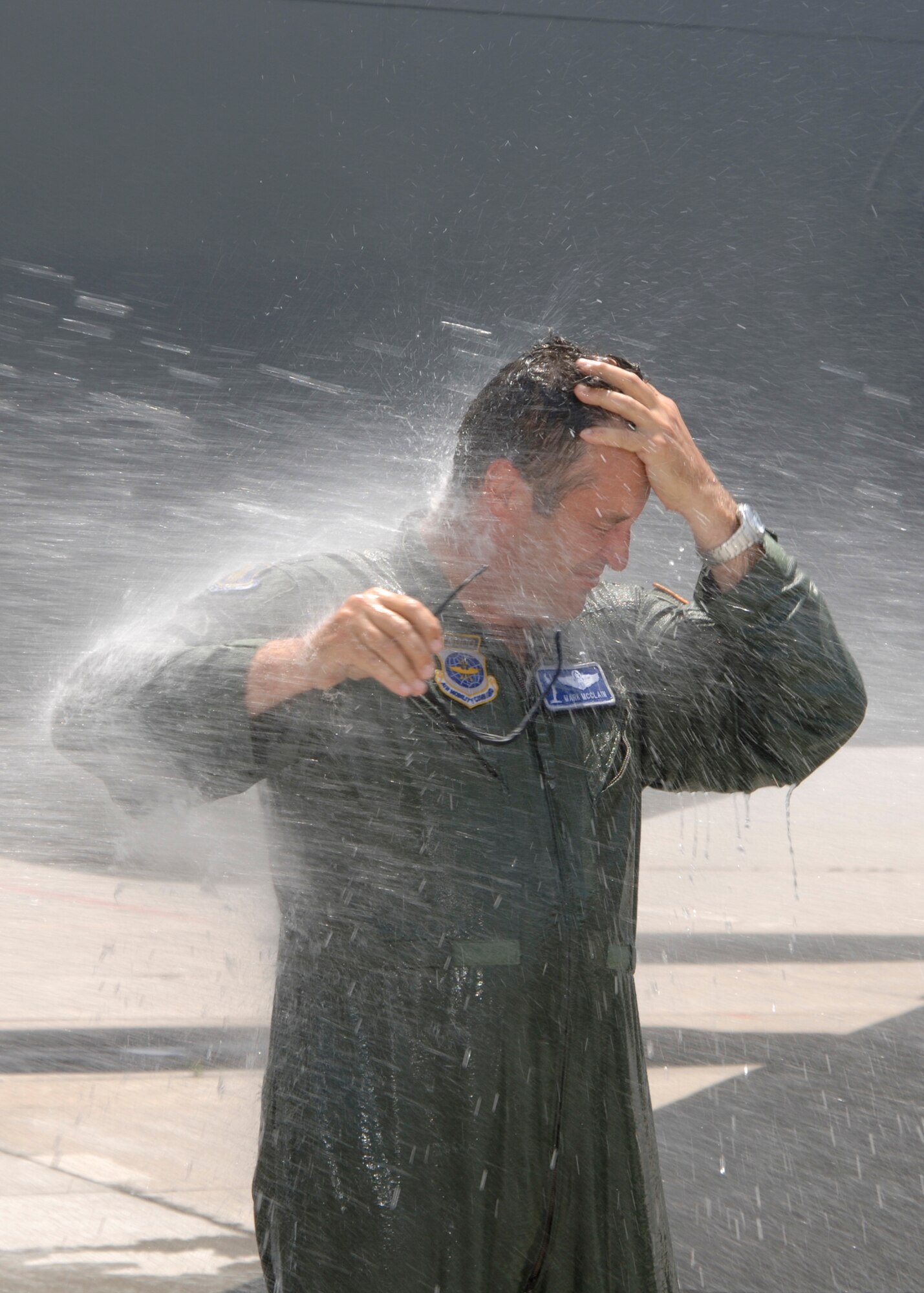 Lt. Col. Mark McClain, 22nd Air Refueling Wing Director of Staff, is hosed-down with water as he completed his final flight on McConnell Air Force Base on a KC-135 Stratotanker June 11. 