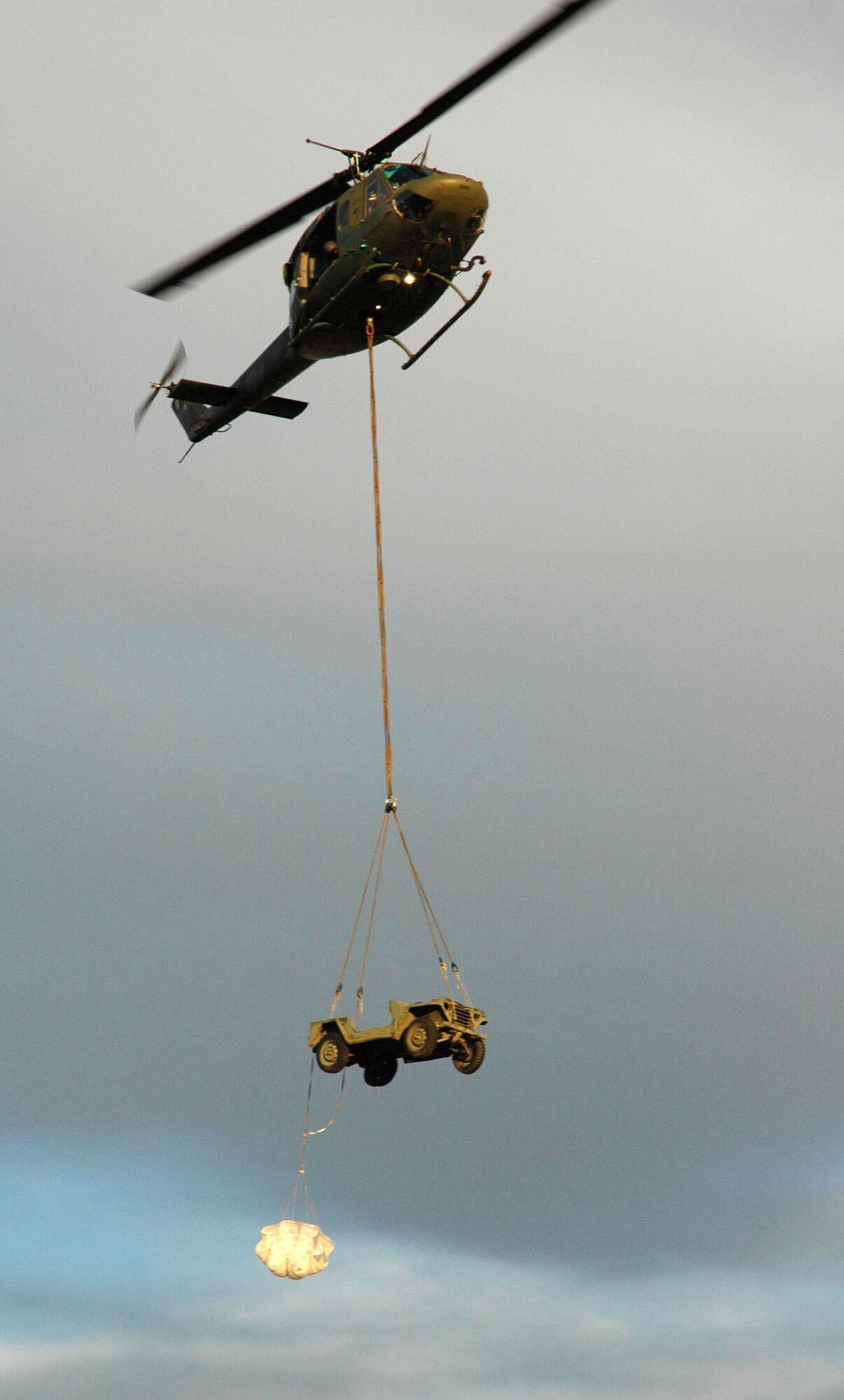 A UH-1N "Huey" assigned to the 36th Rescue Flight "cargo slings" a Jeep during training near Fairchild Air Force Base, Wash.  The 36 RQF supports the U.S. Air Force combat survival school, SERE specialist training, and supports the National Search and Rescue Plan for some off-base civilian emergencies. (U.S. Air Force photo by Senior Airman Jacob Bragg)