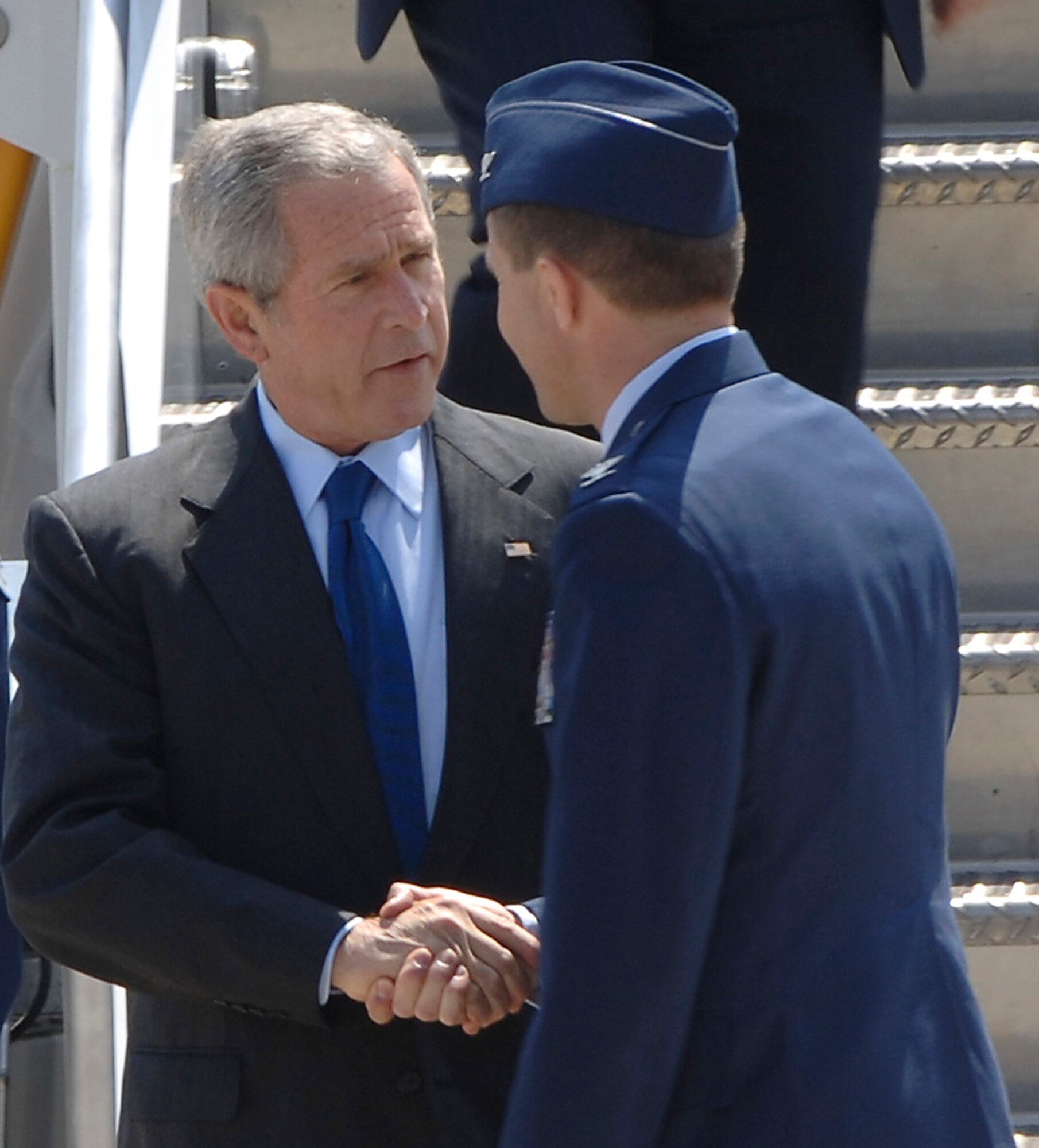 Col. John Zazworsky, 22nd Air Refueling Wing vice commander, greets President George W. Bush upon his arrival at the McConnell Air Force Base/Boeing Aircraft plant runway June 15. The president visited the Boys and Girls Club of South Central Kansas and attended a political fundraiser before heading on to Crawford, Texas. (Photo by Senior Airman Jamie Train)