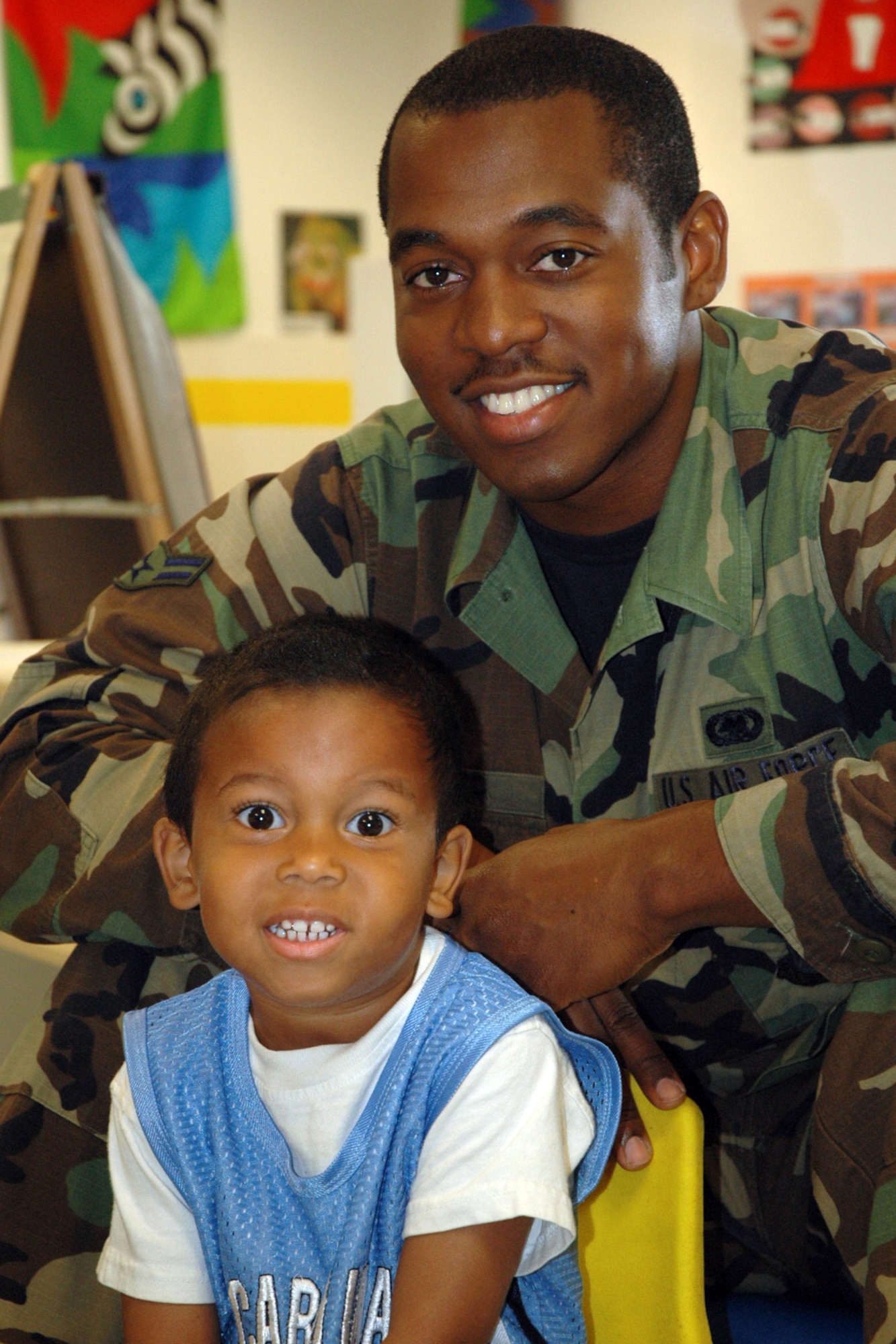 Airman 1st Class Jeremy Hoover, 22nd Logistics Readiness Squadron, and his son, Jeremy, 2 enjoy the annual Father’s Day breakfast at the McConnell Child Development Center, June 15.  (Photo by Tech. Sgt. Genevieve Morris)