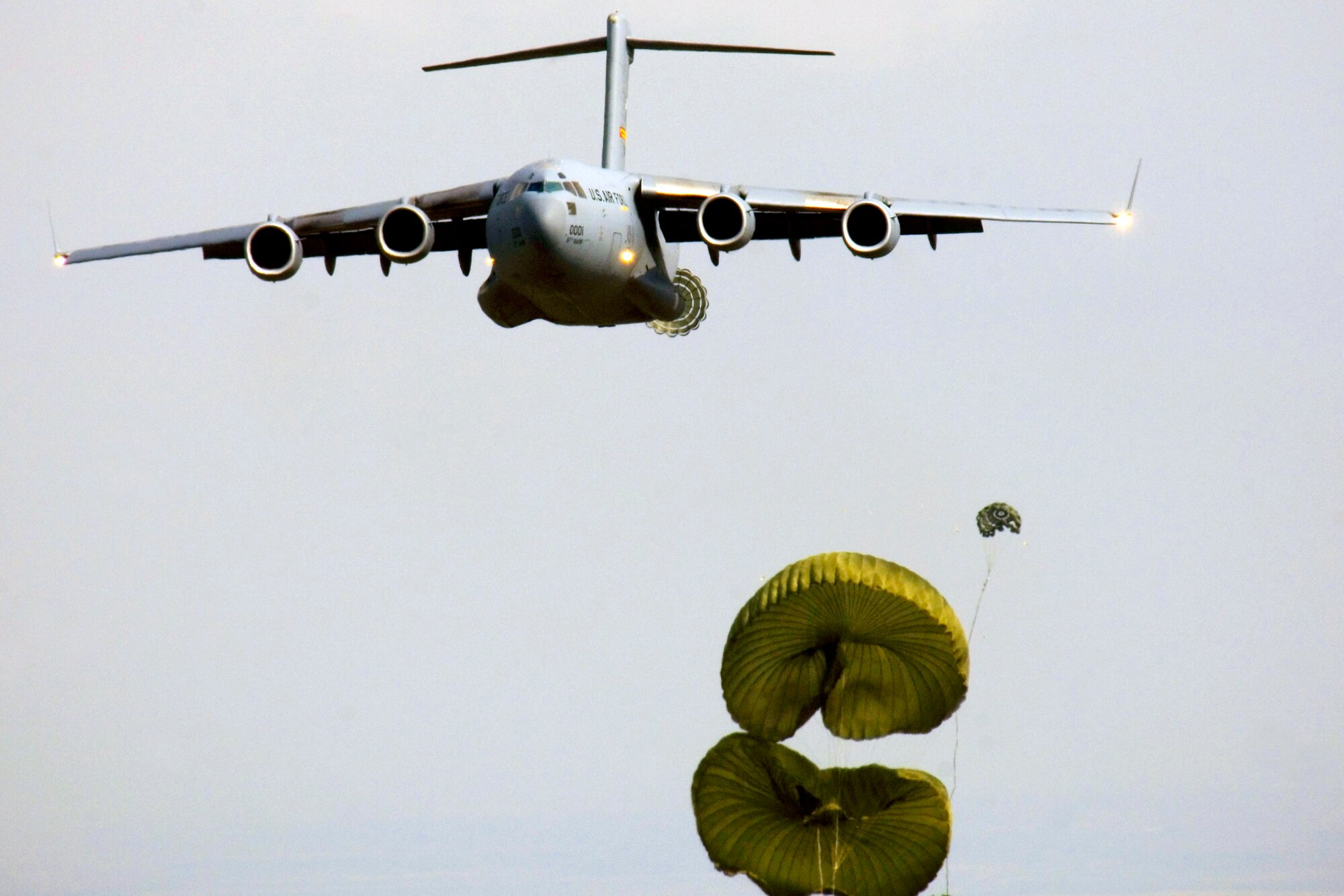 A C-17 Globemaster III drops a cargo load during a recent training mission at Altus Air Force Base, Okla. Student loadmasters log 25 to 30 hours of flight training time in C-17s from the 58th Airlift Squadron. (U.S. Air Force photo/Tech. Sgt. Matt Hannen)