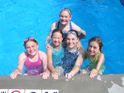 FAIRCHILD AIR FORCE BASE, Wash. – The base outdoor pool here is now open for business. From left, Emilee Melville, 9; Mireille Beaubien, 10; Kelli and Joanie Melville, 12 and 16; and Nicole Beaubien, 8, swim the afternoon away June 20. The Melville sisters are daughters of Col. Mark Melville, 92nd Operations Group commander, and the Beaubien sisters are daughters of Lt. Col. Seth Beaubien, 509th Weapons Squadron commander. The outdoor pool is open weekdays, 1 – 5 p.m., and weekends, noon – 5 p.m. (U.S. Air Force photo/Staff Sgt. Connie L. Bias)
