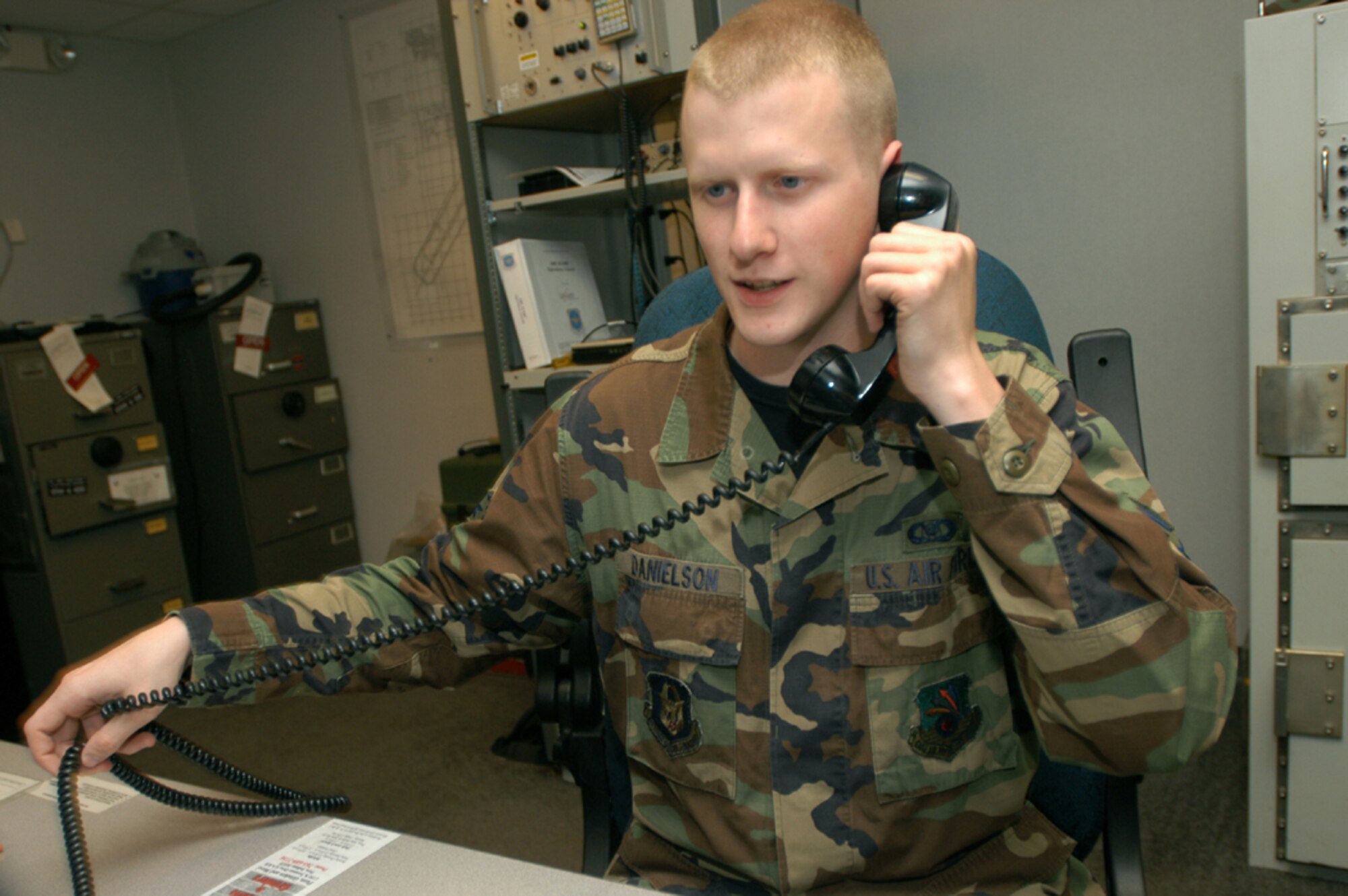 GRISSOM AIR RESERVE BASE, Ind. -- Senior Airman Christopher Danielson, 434th Command Post controller, talks on the phone during the June unit training assembly. Airman Danielson was recently selected to attend the U.S. Air Force Academy, Colo. (U.S. Air Force photo/Senior Airman Mark R. W. Orders-Woempner)