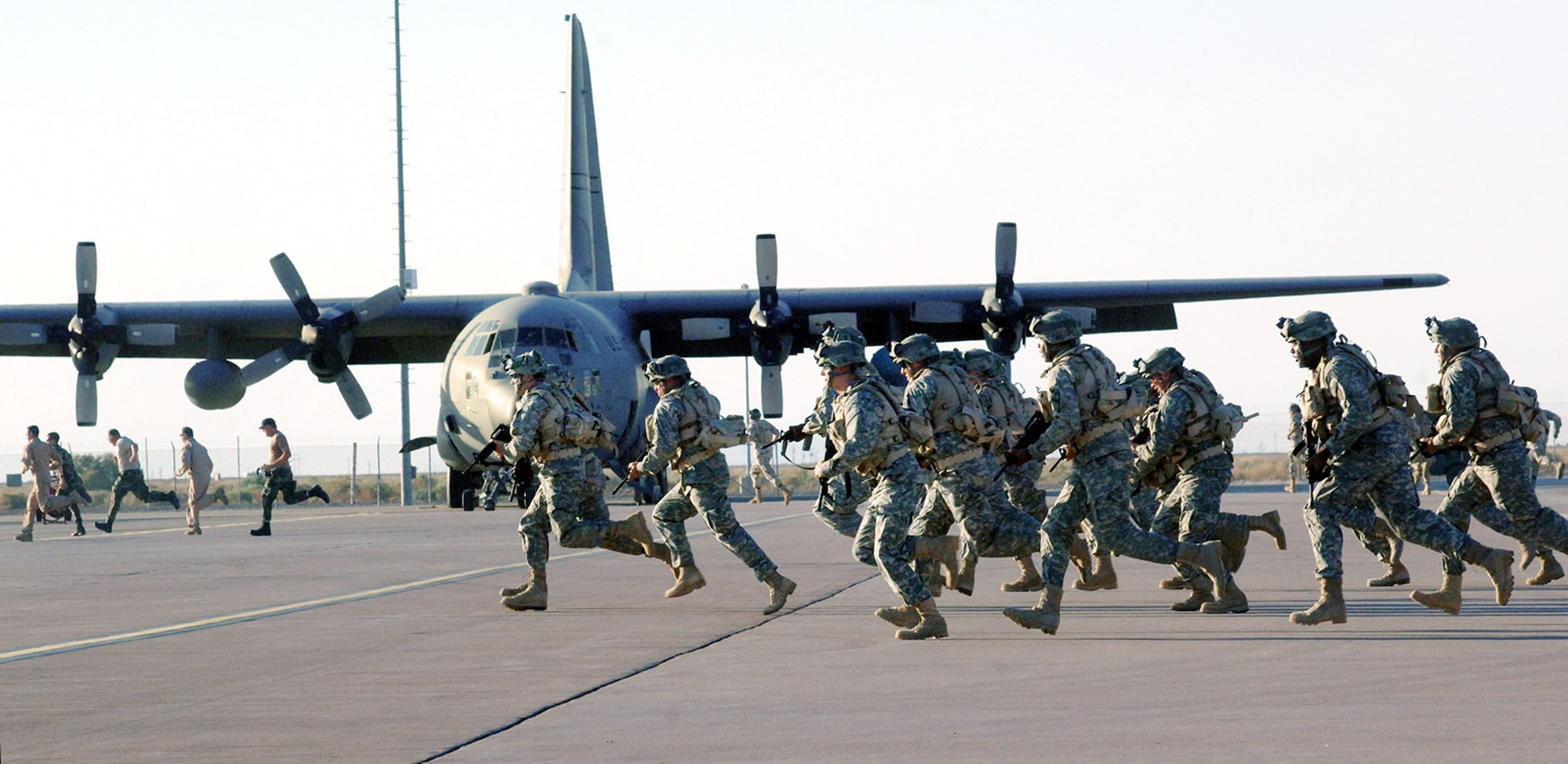 Airmen filling the roles of movie extras run on the set of the movie "Transformers" during filming at Holloman Air Force Base, N.M. The movie, scheduled for release July 4, will feature 300 Airmen and Soldiers alongside military aircraft, including the CV-22 Osprey, F-117 Nighthawk and F-22 Raptor. (U.S. Air Force photo/Tech. Sgt. Larry A. Simmons) 
