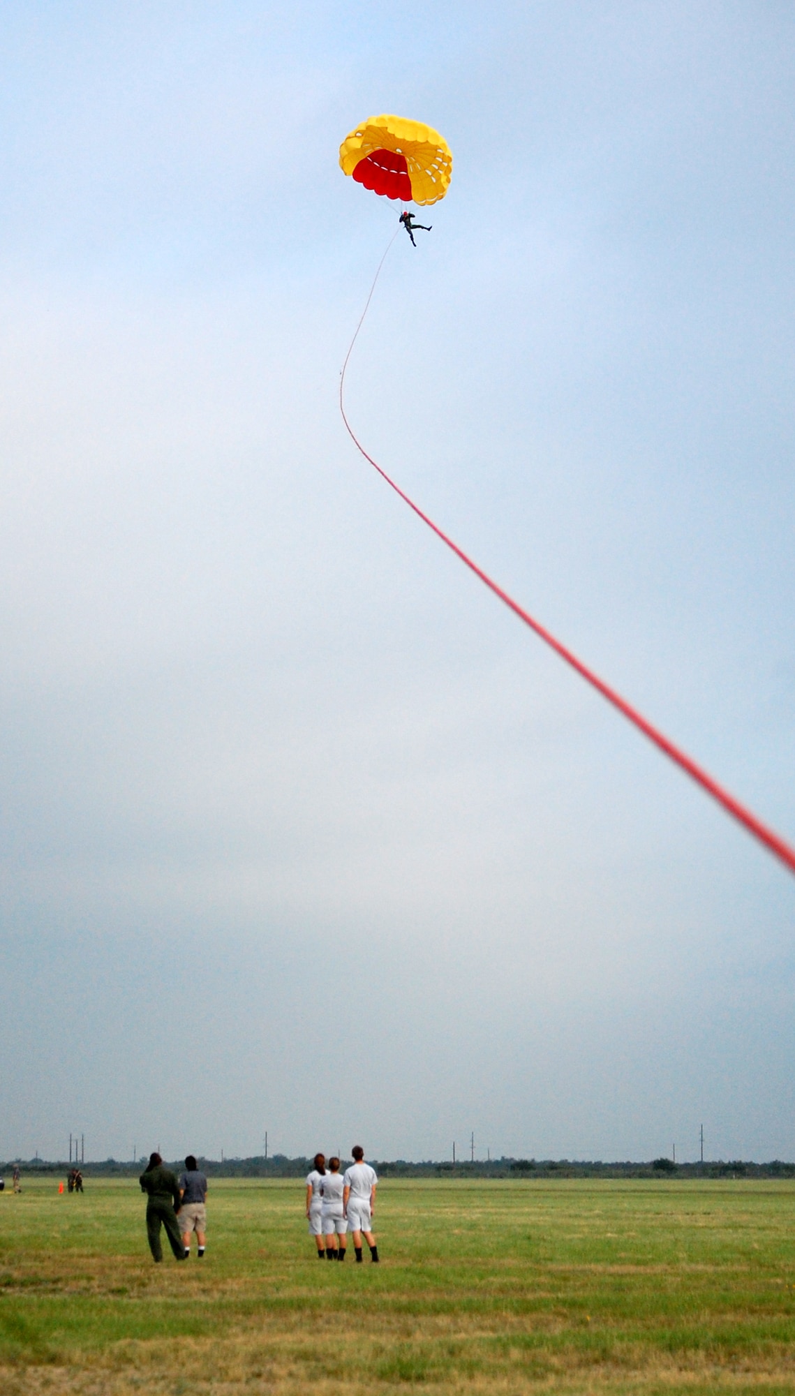 LAUGHLIN AIR FORCE BASE, Texas – A student pilot from SUPT class 08-11 works to steady himself while being pulled up to about 600 feet during parachute training June 19.  (U.S. Air Force photo by Staff Sgt. Austin M. May)