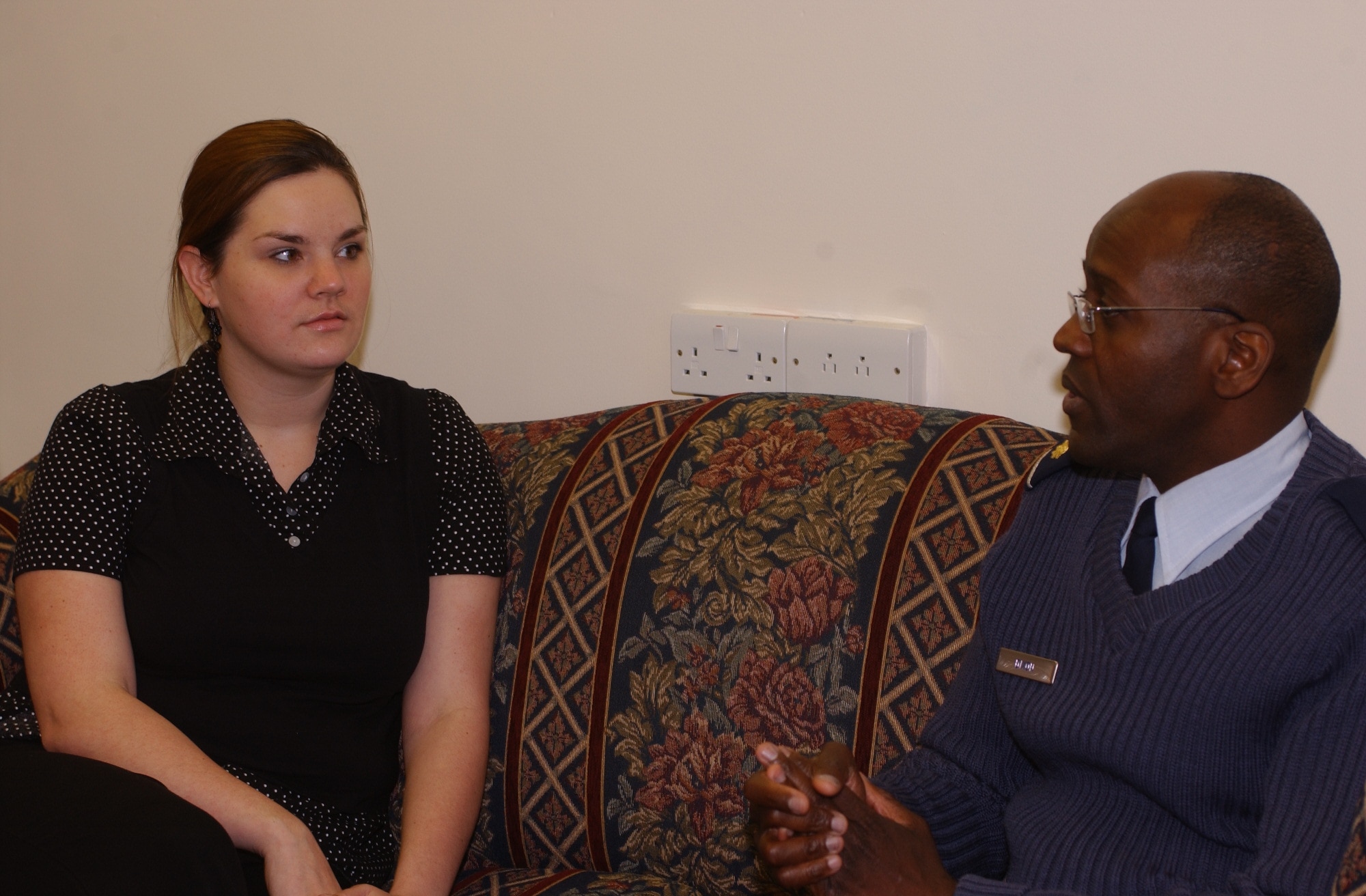 Misty Folger, spouse of Staff Sgt. David Folger of the 48th Equipment Maintenance Squadron, talks with Chaplin (Maj.) Calvin Dixon at the RAF Lakenheath Chapel about the many programs available there. (US Air Force photo by Dr. Jill Fuson)