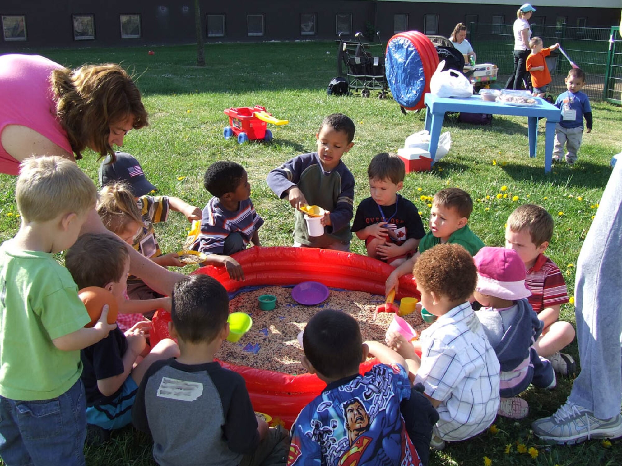 SPANGDAHLEM AIR BASE, GERMANY -- Children and Family Child Care providers play during Spring Fest. Family Child Care is an Air Force program that gives parents an alternative to taking their children to a center-based care provider, while providing a work-at-home opportunity for anyone interested in child care. (Courtesy photo)
