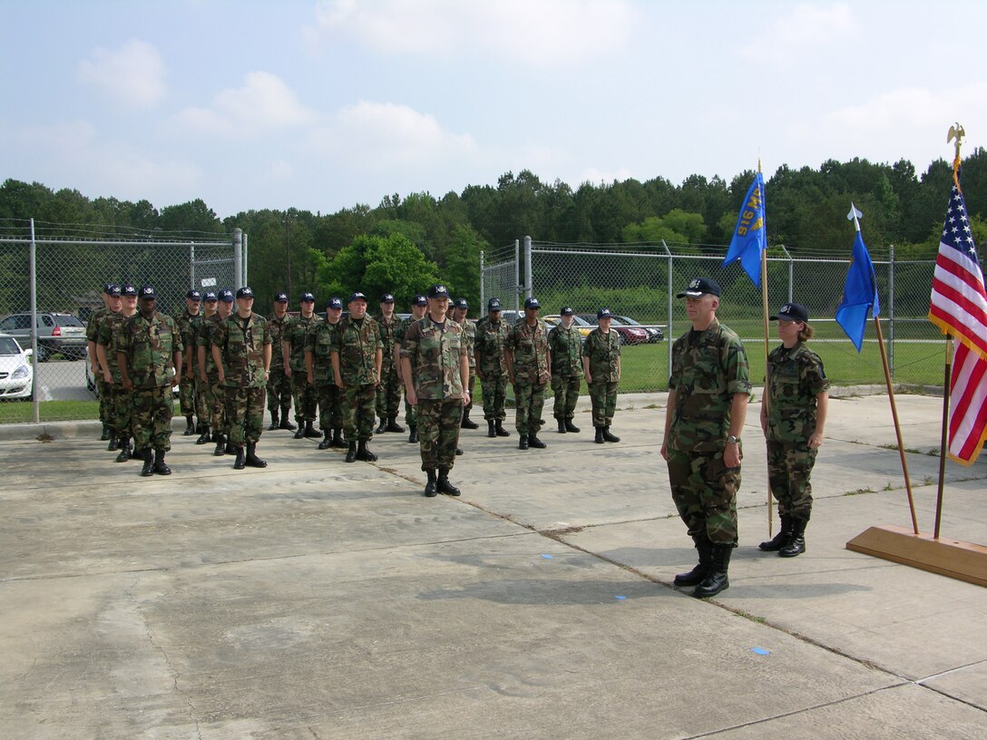 Seymour Johnson Air Force Base, N.C. -- Lt. Col. James Horton (front left) and Maj. Selby Kewin (front right) stand in front of the new 916th Communications Squadron. The 716th Communication Flight was deactivated in May 2007 and became part of the new squadron. A ceremony honoring both flight and squadron was held during the June unit training assembly. The 916th CF is part of the Air Force Reserve. 