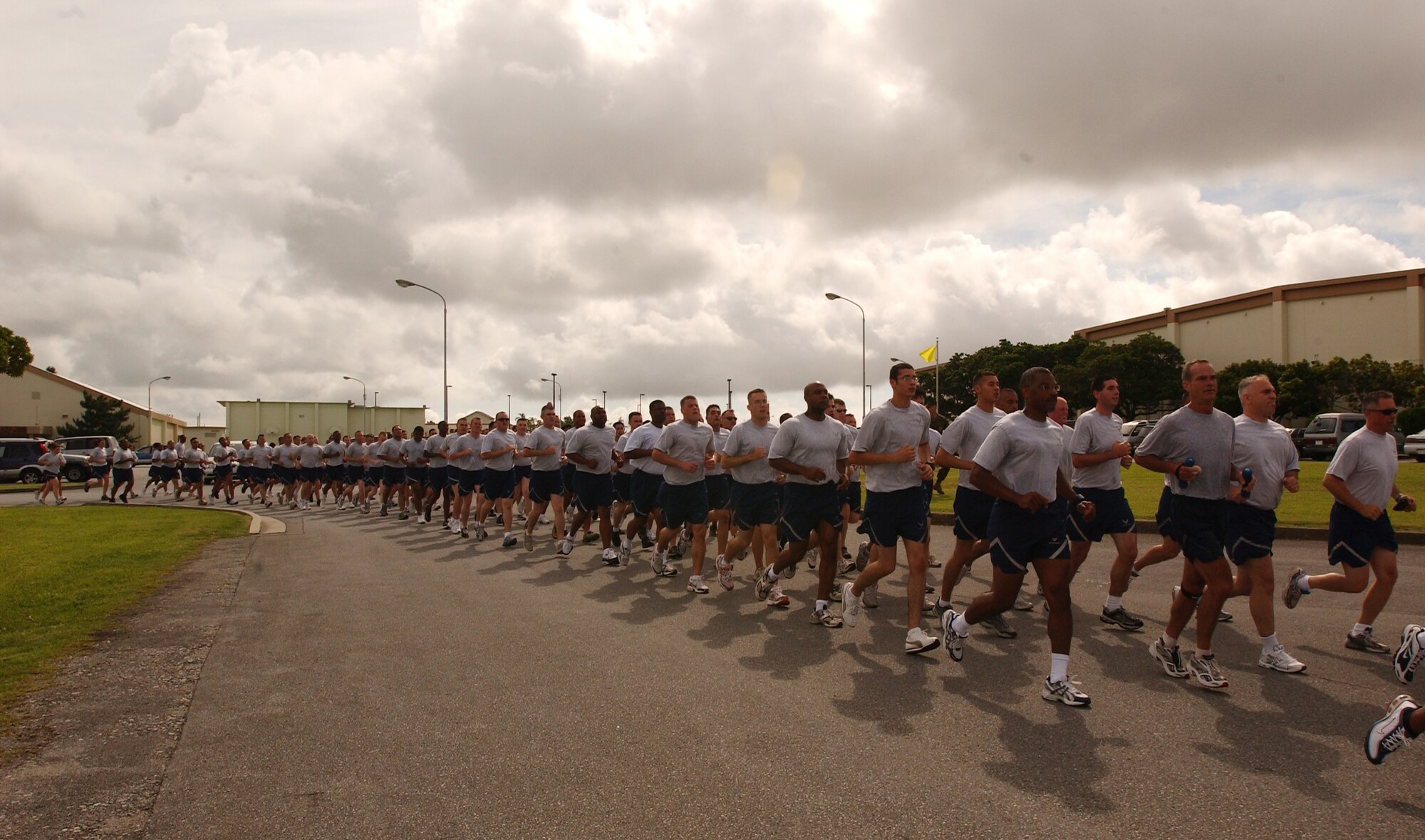 Volunteers from the 18th Security Forces Squadron run from Bldg. 705 to the Risner Gym during the Law Enforcement Torch Run June 16 at Kadena Air Base, Japan. The Torch Run is affiliated with Special Olympics nation wide and was adopted at Kadena to promote awareness for the annual event here. (U.S. Air Force photo by Staff Sgt. Reynaldo Ramon)