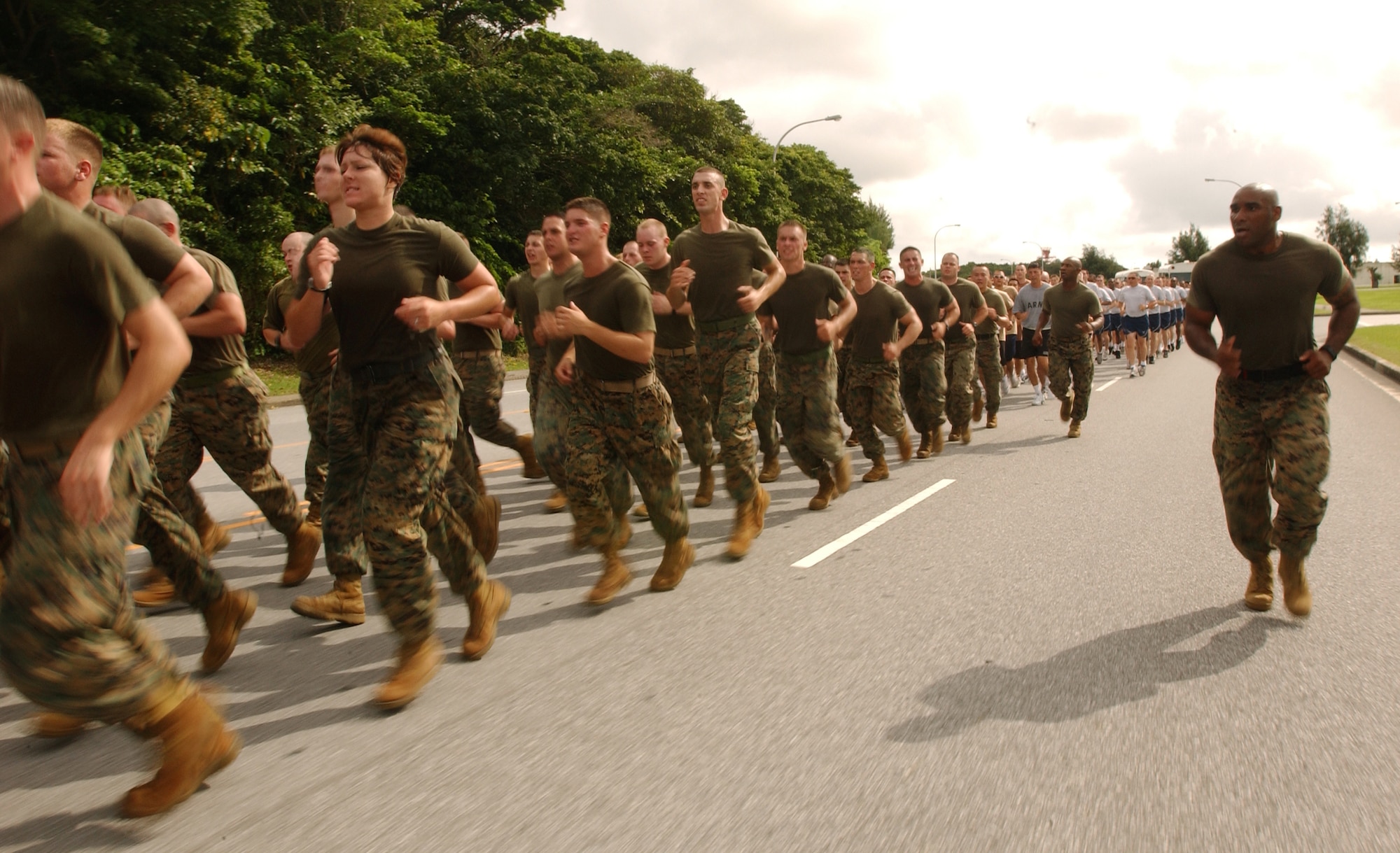 Marines from Camp Foster participate in the Law Enforcement Torch Run at Kadena Air Base, Japan, June 16. Army, Navy and Air Force volunteers also joined in the run from Bldg. 705 to the Risner Gym. The Torch Run is affiliated with Special Olympics nation wide and was adopted at Kadena to promote awareness for the annual event here.   (U.S. Air Force photo by Staff Sgt. Reynaldo Ramon)
