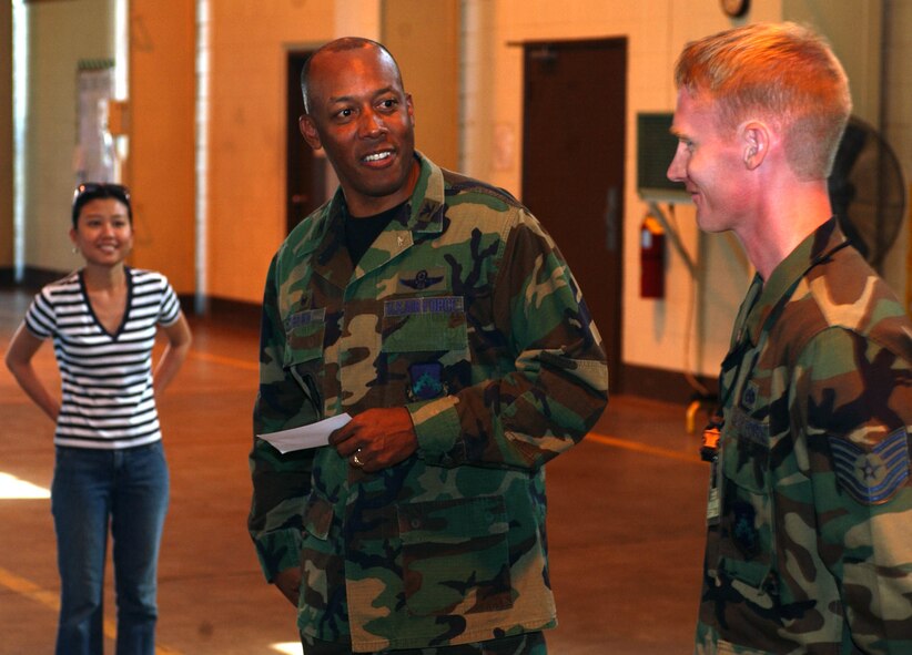 KUNSAN AIR BASE, Republic of Korea -- Tech. Sgt. Richard Barrett, 8th Maintenance Squadron, NCOIC of engine test cell, receives a suprise visit by Col. CQ "Wolf" Brown, 8th Fighter Wing commander Monday. Sergeant Barrett was recognized as this week's "Pride of the Pack." (U.S. Air Force photo/Senior Airman Steven Doty) 