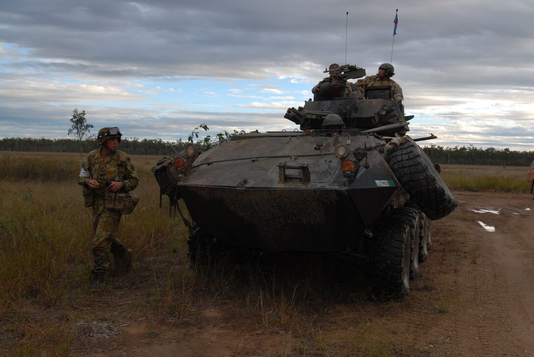 U.S. Marines with the 3rd Marine Expeditionary Brigade patrol a paratrooper drop zone prior to an air insertion exercise, June 19, 2007, for 3rd Battalion, Royal Australian Regiment at Shoalwater Bay Training Area, Australia, during Talisman Saber 2007. The biennial, U.S. and Australian led Joint Task Force exercise is designed to prepare both nations for crisis action planning and executing contingency operations. The exercise also supports increased flexibility and readiness, which are force multipliers in winning the global war on terror. 