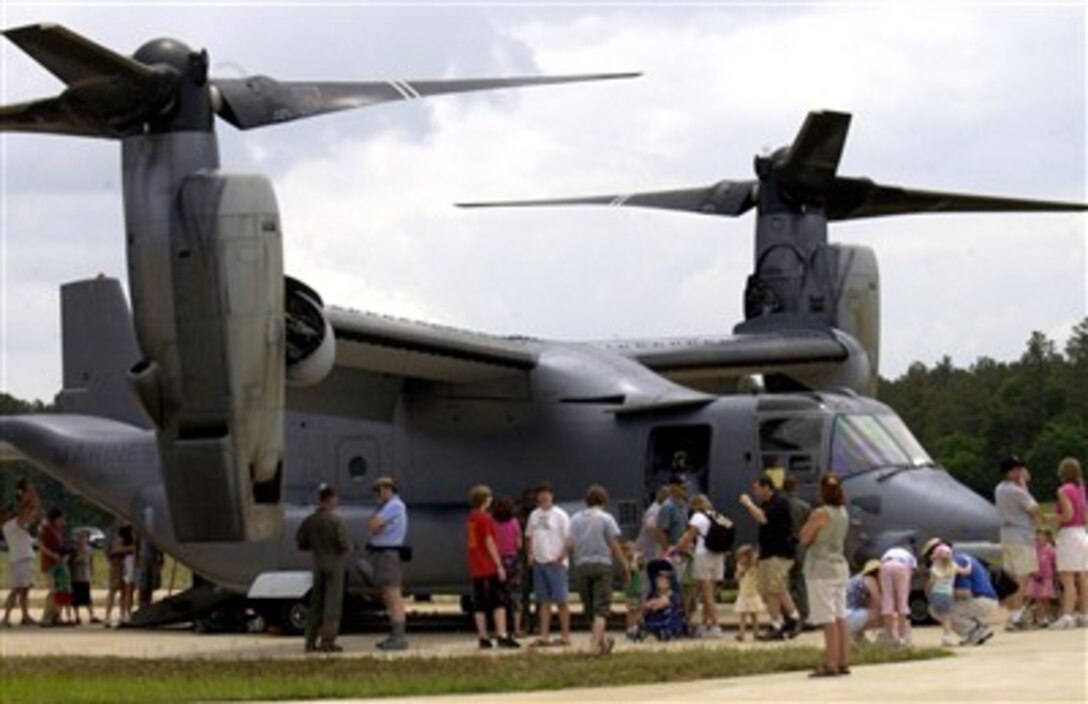 Visitors gather around a Marine MV-22 Osprey at the "Reach for the Sky" family day at the National Air and Space Museum's Udvar-Hazy Center in Chantilly, Va., June 16, 2007. The airshow featured several static civilian and military aircraft in addition to the museum's vast array of air and space displays. 