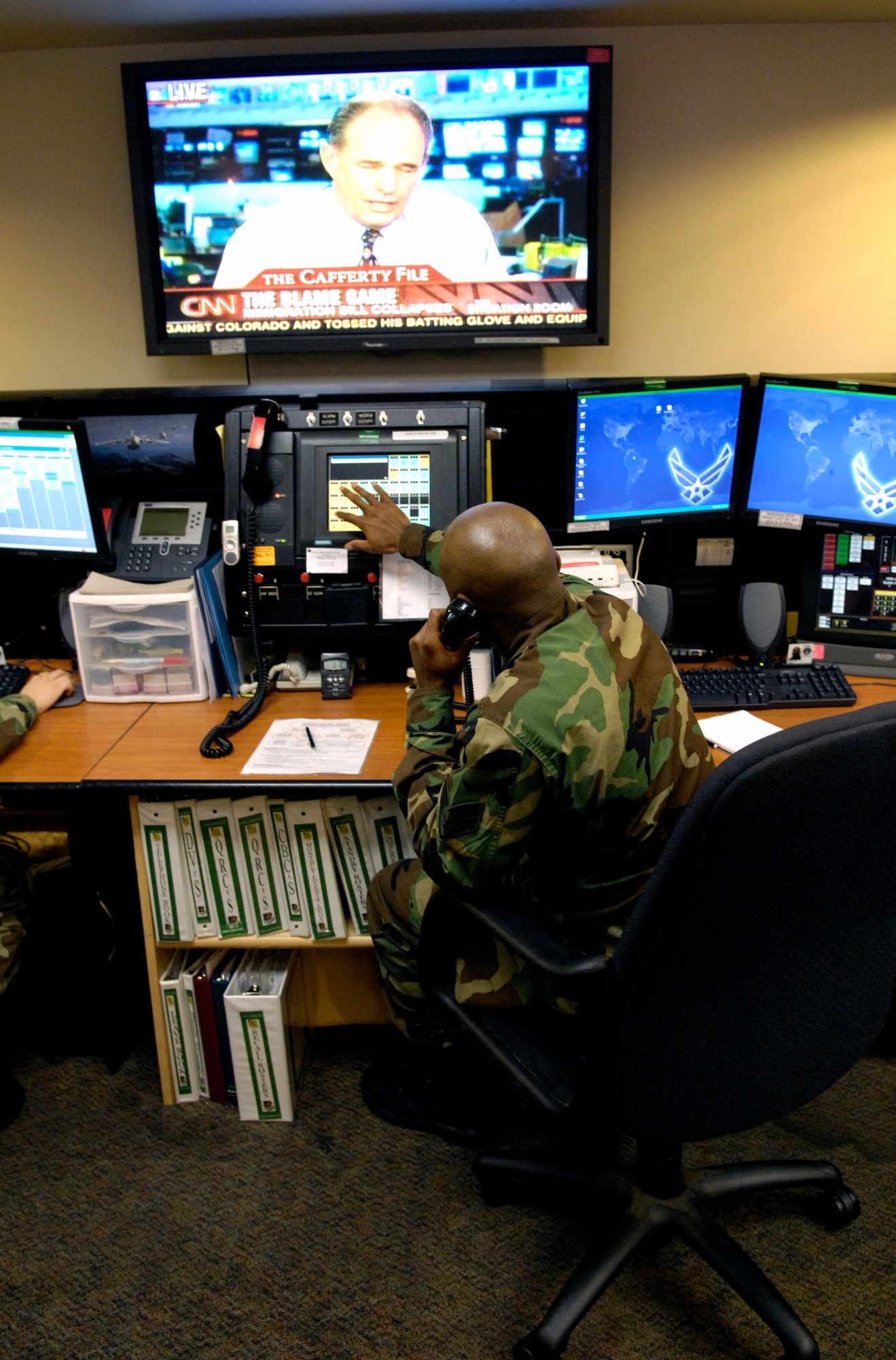 Staff Sgt. Lynn Brown works at his control console inside the command post June 8 at Hickam Air Force Base, Hawaii. Sergeant Brown is an emergency actions controller with the 15th Airlift Wing. (U.S. Air Force photo/Tech. Sgt. Shane A. Cuomo) 
