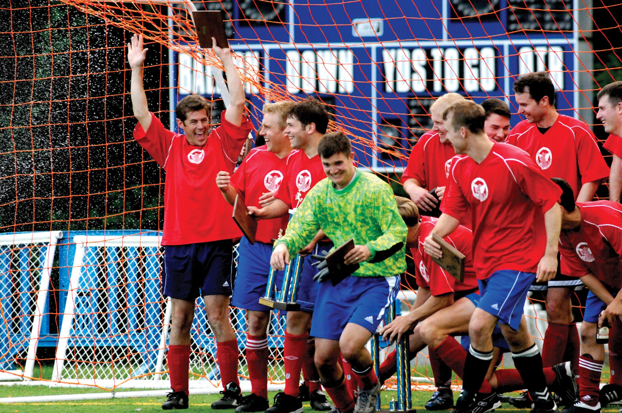 MCCHORD AIR FORCE BASE, Wash. -- Members of the 4th and 728th Airlift Squadron intramural soccer team celebrate following a 5-1 victory over the 62nd Maintenance Squadron in the intramural soccer championship game June 15 at Rainier Field.  (U.S. Air Force photo/Abner Guzman)