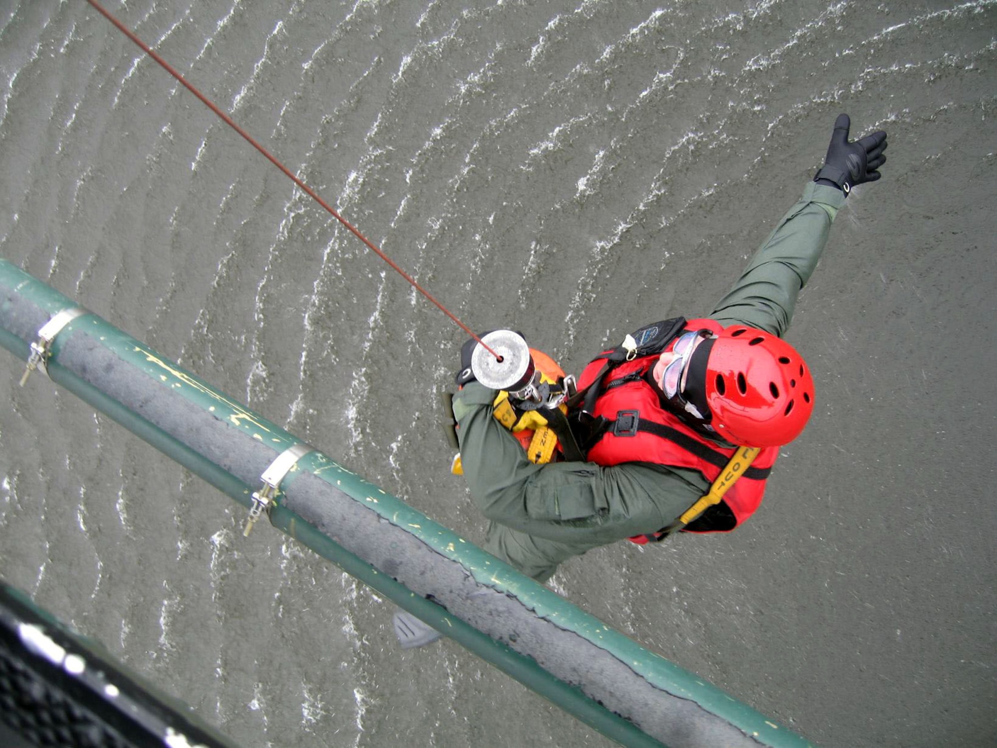 Staff Sgt. George Gonzalez practices water hoist procedures from a UH-1N Huey at Fairchild Air Force Base, Wash. Sergeant Gonzalez is an independent duty medical technician assigned to the 36th Rescue Flight as a flight medic in support of survival, evasion, resistance and escape specialist training and the Air Force combat survival school. (U.S. Air Force photo/Senior Airman Jacob Bragg) 
