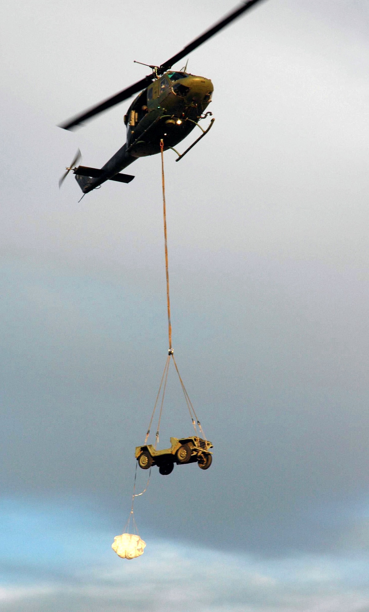 A UH-1N Huey assigned to the 36th Rescue Flight cargo slings a Jeep during training near Fairchild Air Force Base, Wash. The 36th Rescue Flight supports the Air Force combat survival school, survival, evasion, resistance and escape specialist training, and supports the National Search and Rescue Plan for some off-base civilian emergencies. (U.S. Air Force photo/Senior Airman Jacob Bragg) 
