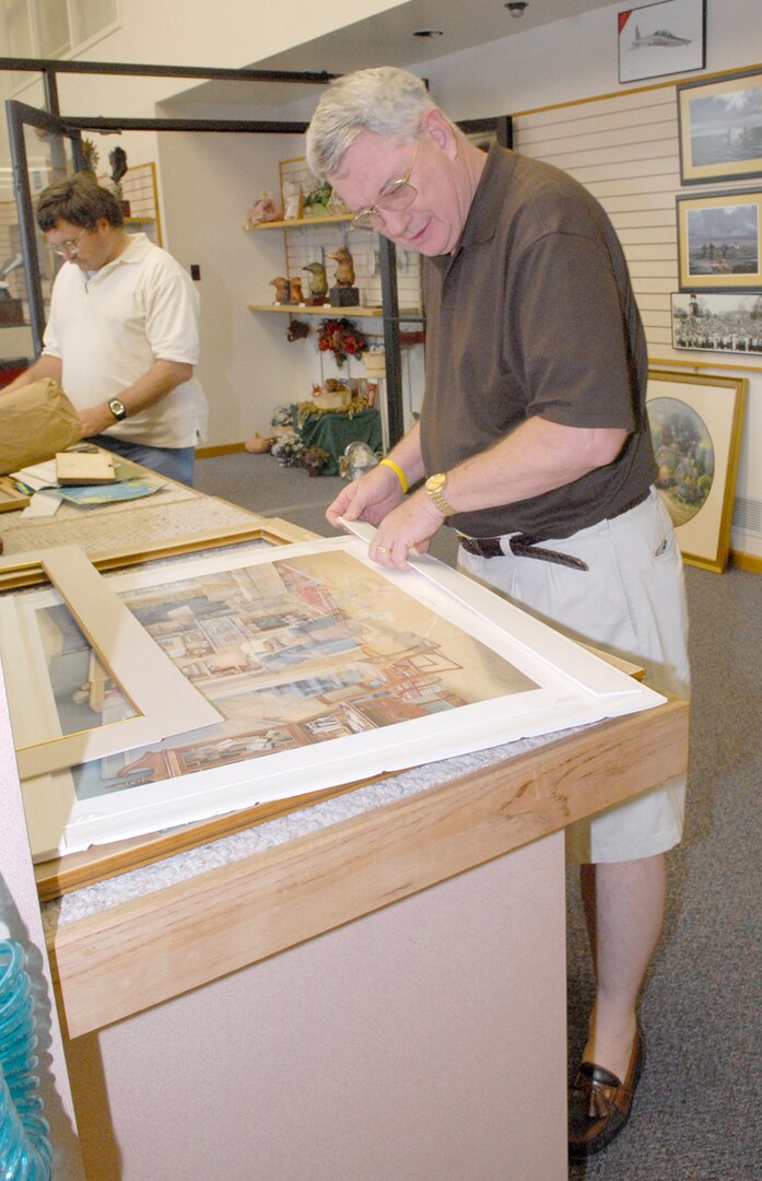 Lt. Col. James Taylor of the 12th Flying Training Wing prepares matting for a painting while at the arts and crafts center’s frame shop. (U.S. Air Force photo by Rich McFadden)