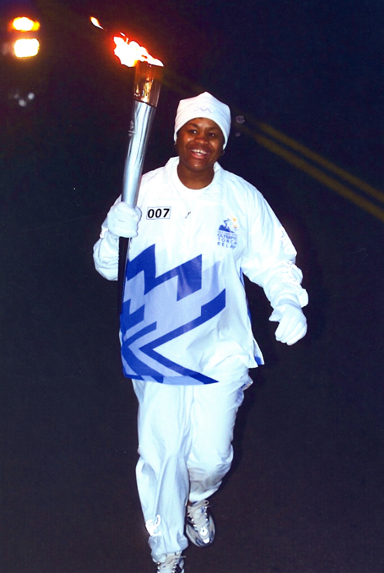 FAIRCHILD AIR FORCE BASE, Wash. -- Celestine Kuntz, Health and Wellness Center health education program manager, carries the 2002 Olympic Torch. At the time, she was nine months pregnant and only two years earlier had been diagnosed with a brain tumor, for which she immediately went into surgery for. 