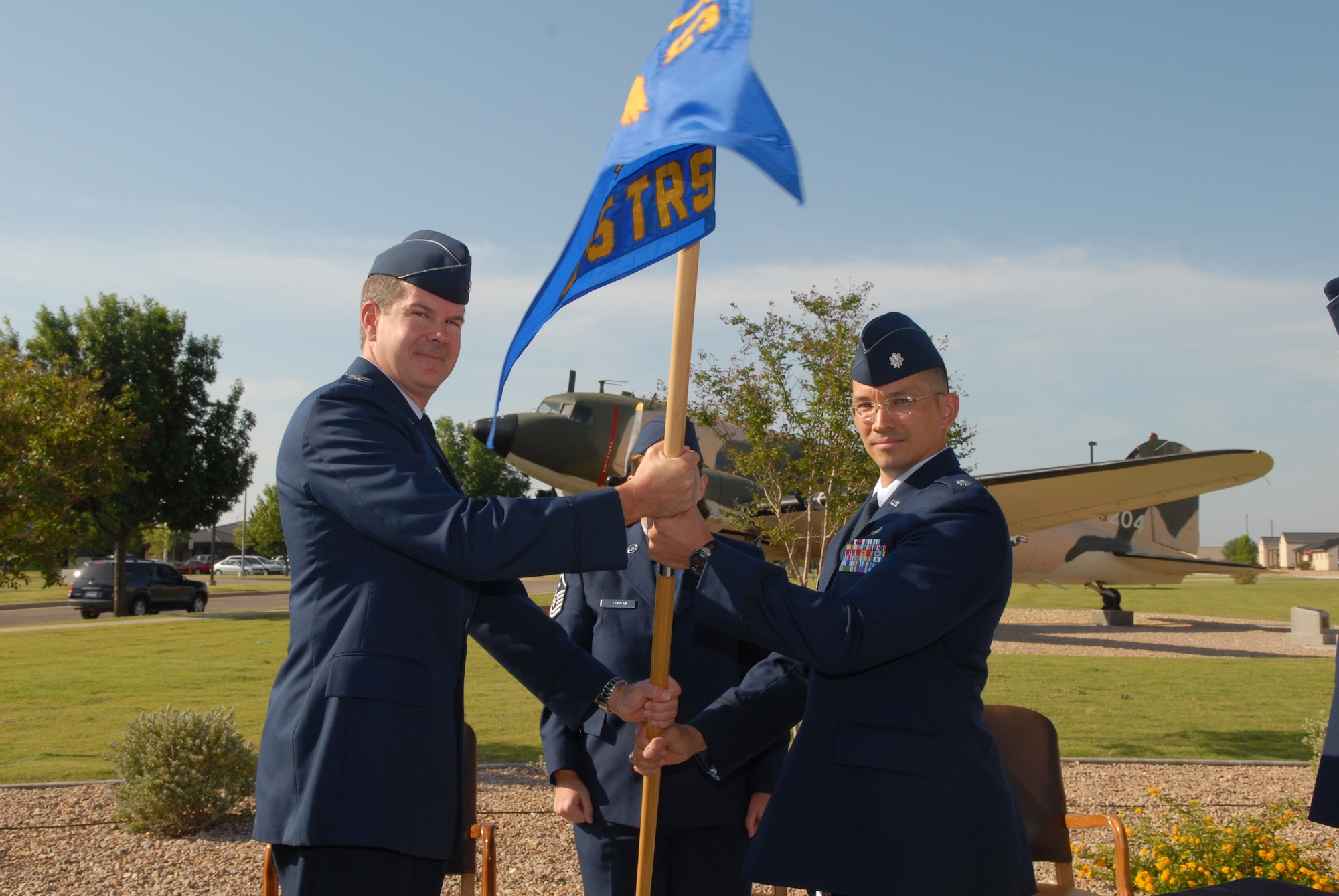 Col. D. Scott George, 17th Training Group commander, passes the 315th Training Squadron guidon to Lt. Col. Thomas Hensley during a change-of-command ceremony, which took place June 14 in front of the Norma Brown Building. Lt. Col Hensley replaced Lt. Col. Devin Swallow. (U.S. Air Force photo by Tech. Sgt. Gina O’Bryan)
