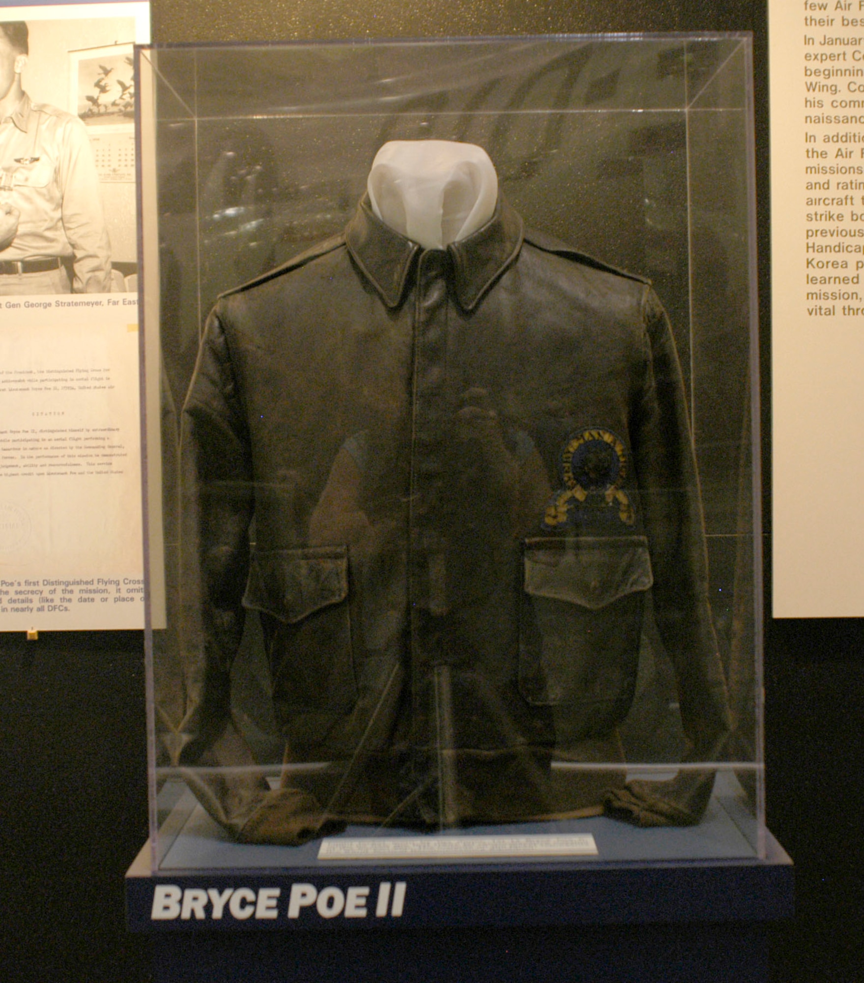 DAYTON, Ohio -- Flight jacket worn by the donor, 1st Lt. Bryce Poe II, when he flew the first U.S. Air Force jet reconnaissance mission of the Korean War. The insignia on the jacket represents the 82nd Tactical Reconnaissance Squadron. The jacket is on display in the Korean War Gallery at the National Museum of the U.S. Air Force. (U.S. Air Force photo)