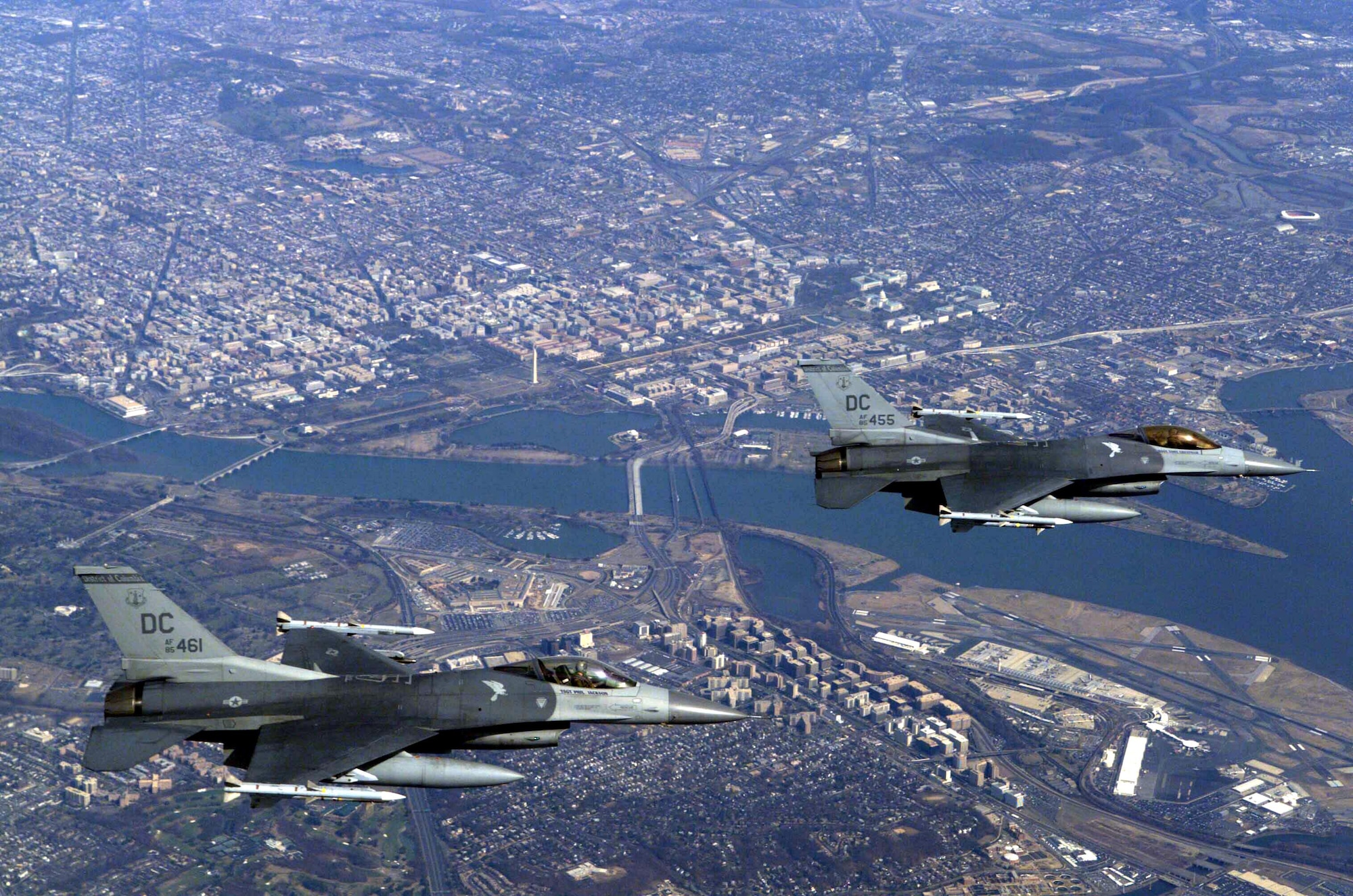 Two US Air Force (USAF) F-16C Fighting Falcon aircraft from the 121st Fighter Squadron, 113th Wing, District of Columbia (DC) Air National Guard (ANG), in flight over the nation's Capital, during a Combat Air Patrol mission in support of Operation NOBLE EAGLE.  Air Force fighters and civilian aircraft will participate in FALCON VIRGO 07-09, a monthly National Capitol Region exercise, June 25 through June 29.  Air Force photo by Senior Airman Dennis Young