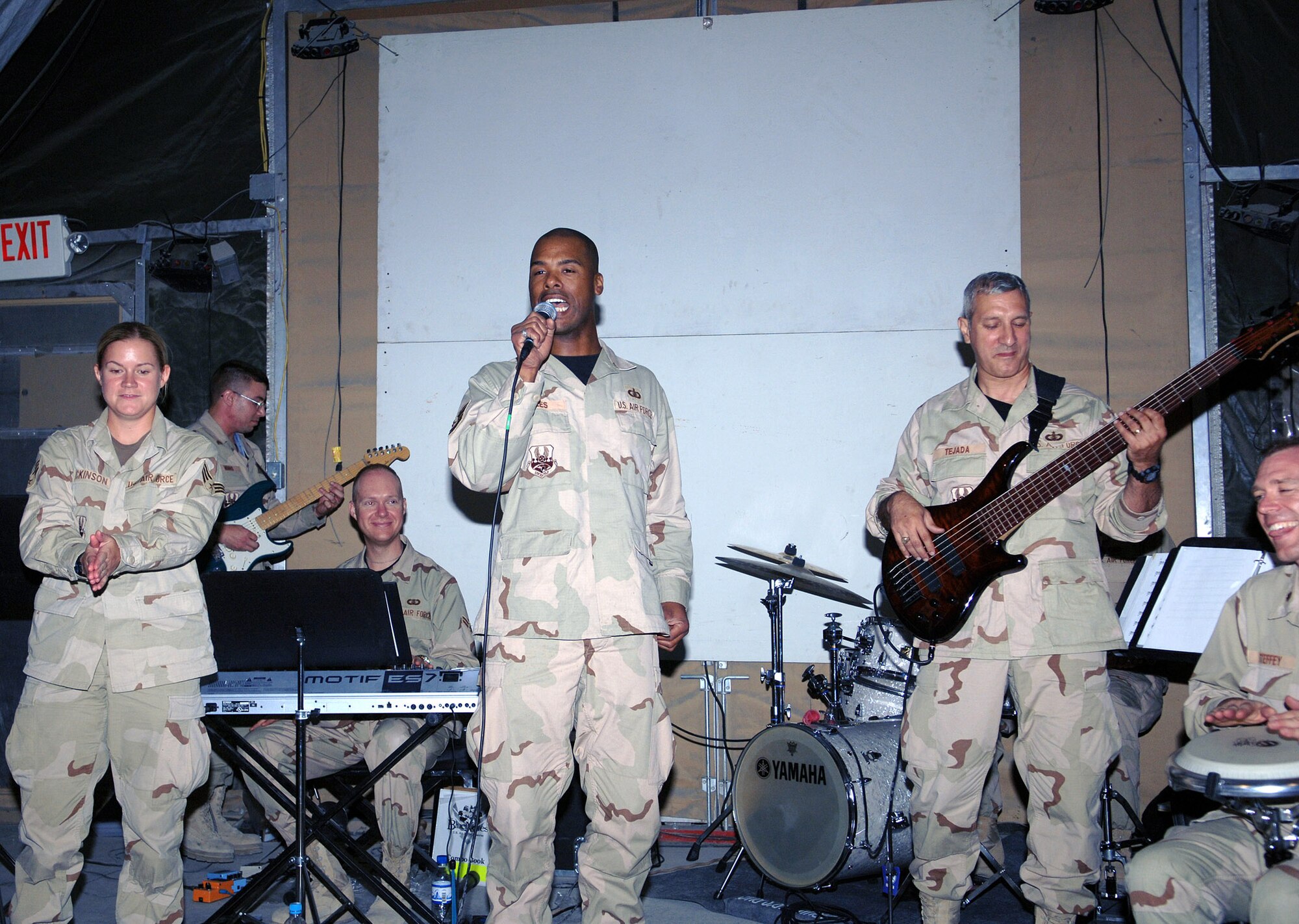 (From left to right) Senior Airman Helen Dickinson, CENTAF band vocalist, Airman 1st Class Robert Barnes, keyboardist, Tech. Sgt. Aaron Miles, vocalist, Tech. Sgt. Doug Tejada, bass player and Maj. Chad Steffey, percussionist and CENTAF band commander, perform in the recreation tent June 19 in Camp Cunningham at Bagram Airfield, Afghanistan. The CENTAF band will be performing at Bagram again July 3. (photo by Staff Sgt. Craig Seals)