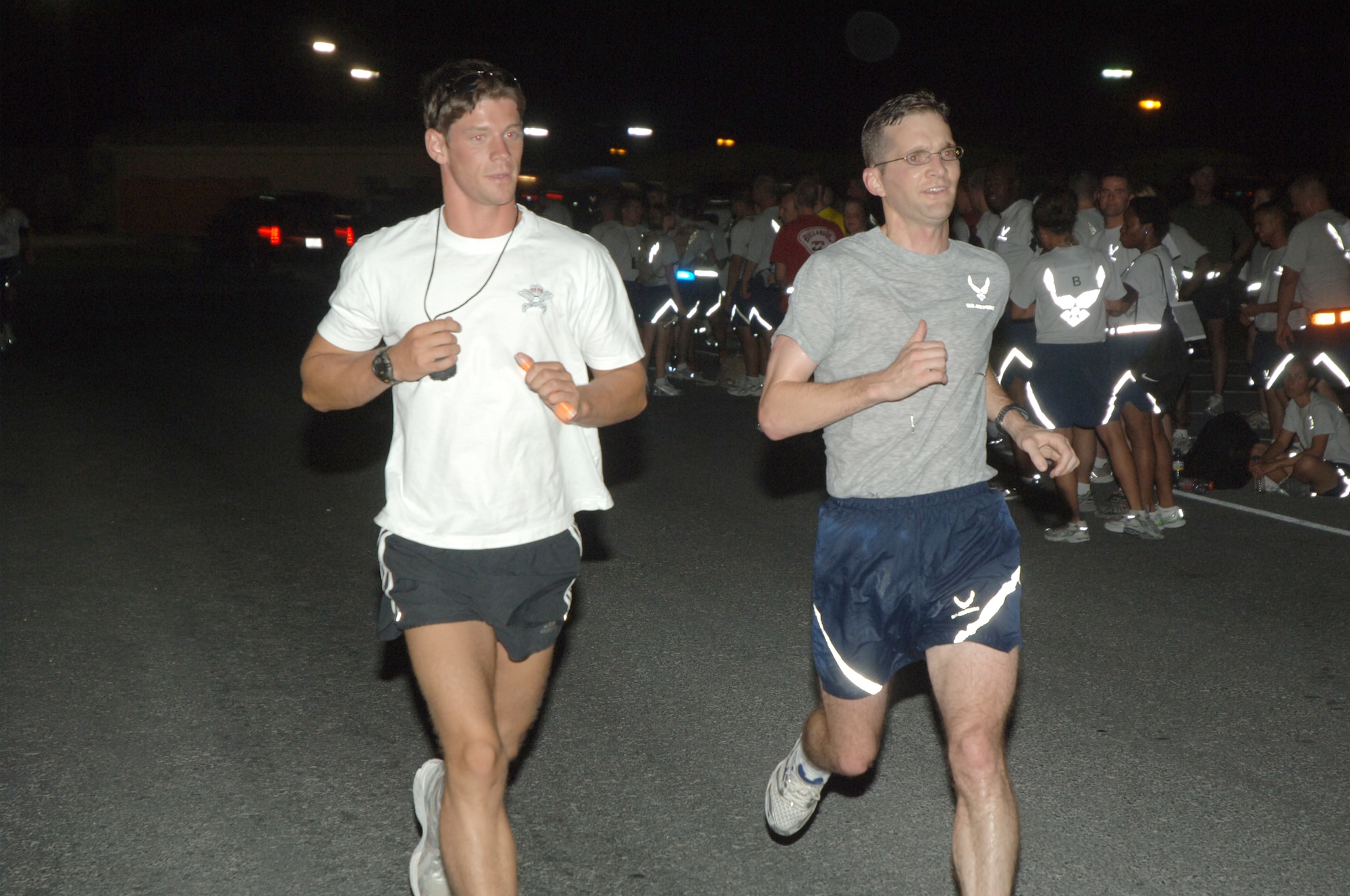 Members of the Desert Eagle Team log another lap during a half marathon held here June 18. The race was organized by the British Royal Air Force to benefit the British Limbless Ex Service Members Association. (U.S. Air Force photo by Master Sgt. Ken Stephens)