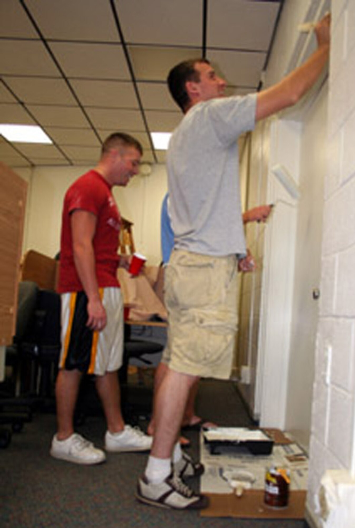 Airmen help paint the library June 15. All in all, more than 45 Airmen volunteered and managed to paint the entire facility in just one day. (U.S. Air Force photo by Jamie Haig)