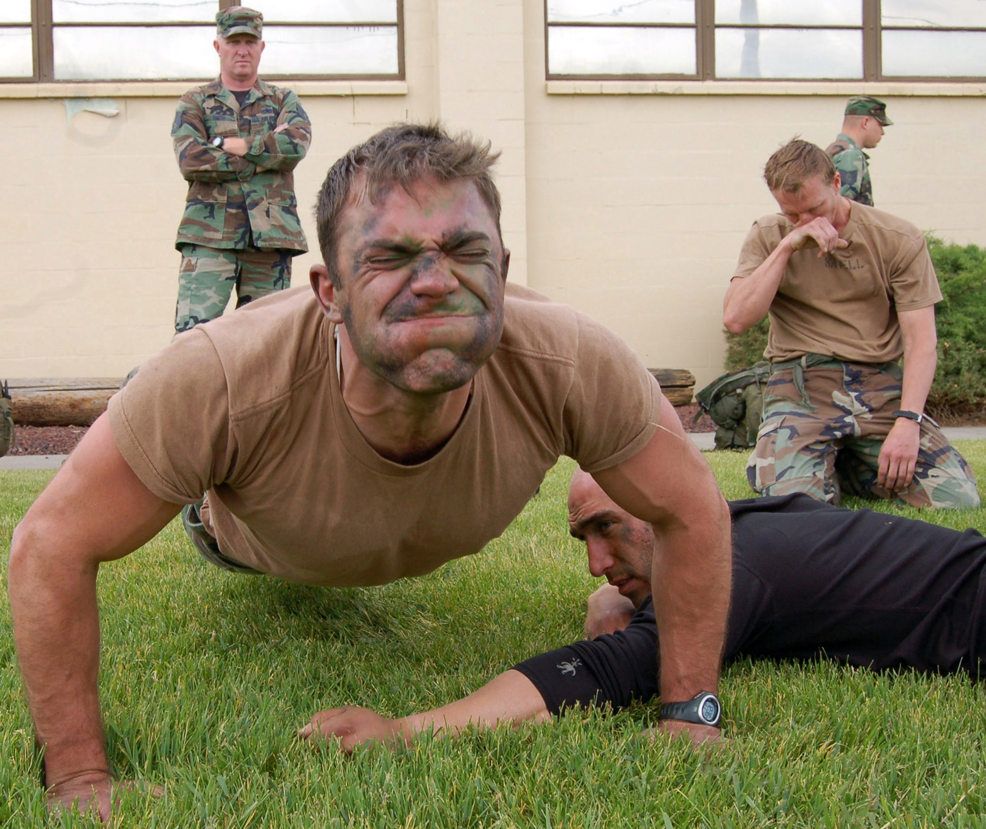 Staff Sgt. Matthew Zimmer pumps out as many push-ups as he can during the physical fitness portion of the Survival, Evasion, Resistance and Escape Challenge at Fairchild Air Force Base, Wash.  The participants in the challenge include SERE specialists, combat rescue officers and pararescuemen.  (U.S. Air Force photo/Staff Sgt. Matthew Rosine)
