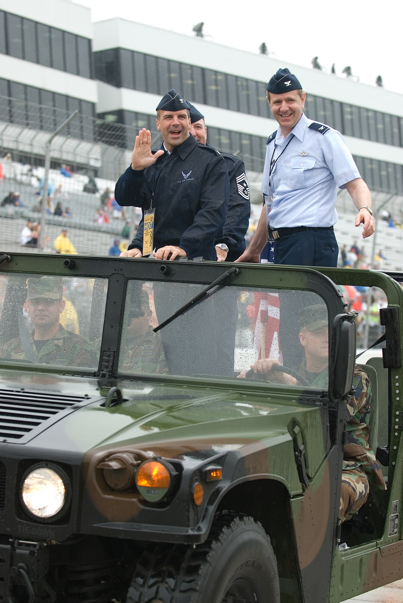 DOVER AIR FORCE BASE, Del. -- Col. David H. Wuest, 512th Airlift Wing vice commander,  Col. Chad Manske, 436th Airlift Wing vice commander, and Chief Master Sgt. Bruce D. Blodgett, 436th AW command chief, ride in the parade lap at the NASCAR Nextel Autism Speaks 400, Dover International Speedway, June 3.  (U.S. Air Force photo/Roland Balik)