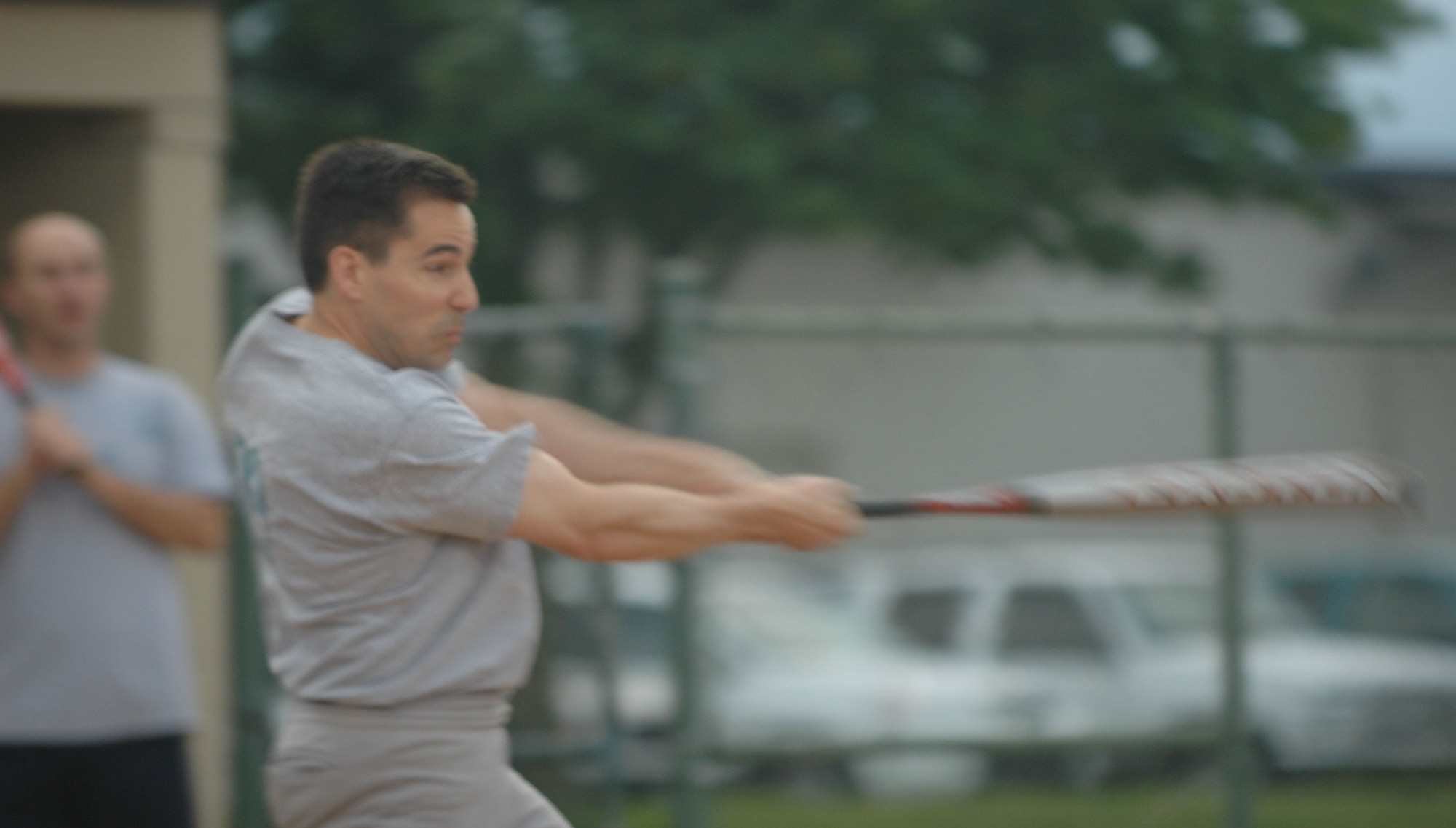 DOVER AIR FORCE BASE, Del. -- Maj. Scott Erickson of the 512th Operations Group softball team pummels the ball into the outfield helping the team in their win over 436th Logistics Readiness Squadron at the baseball field here June 13.  The 512th OG came in to the game with their first win of the season against a forfeiting MOS June 11. (U.S. Air Force photo/Senior Airman Andria Allmond)