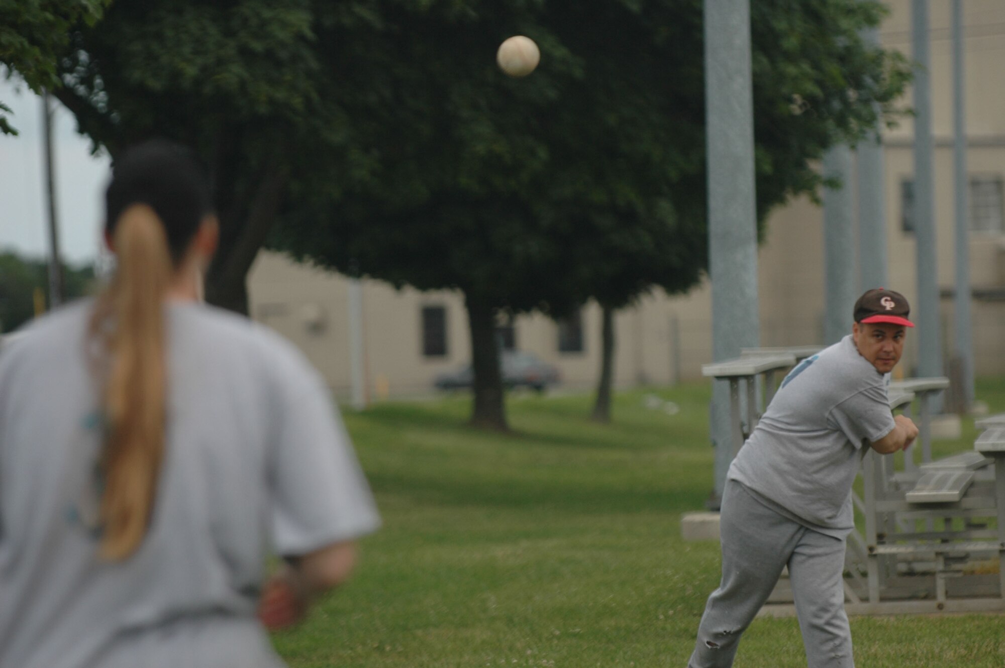 DOVER AIR FORCE BASE, Del. -- Lt. Col. Mike Semo and his wife Heather Semo of the 512th Operations Group softball team warm up for the game June 13 at the baseball field here.  The Liberty Wing team edged out the 436th Logistics Readiness Squadron to win 16-15. (U.S. Air Force photo/Senior Airman Andria Allmond)