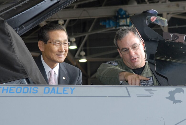 KUNSAN AIR BASE, Republic of Korea -- Colonel Preston "Wolf 2" Thompson, the 8th Fighter Wing Vice Commander, shows the inside of a F-16 cockpit to Song, Ch'ang Jin, the Chairman of the Korean Red Cross Chonbuk Province Chapter June 21. Members of the Korean Red Cross visited the base for an orientation tour. (U.S. Air Force photo/Staff Sgt Darcie Ibidapo)