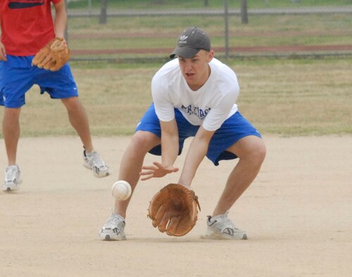 KUNSAN AIR BASE, Republic of Korea -- Reid Geiser, a Cadet from the U.S. Air Force Academy, catches a ground ball during a softball game here June 21. (US Air Force photo/Staff Sgt. Darcie Ibidapo)