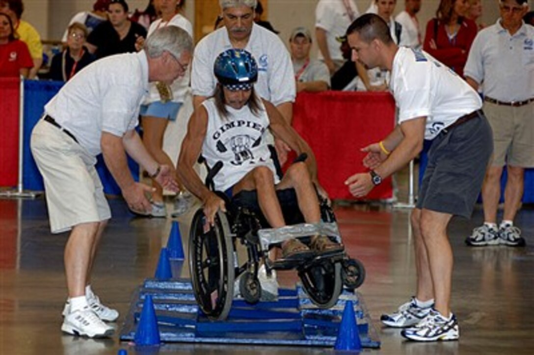 U.S. Air Force veteran Daniel Young masters the slalom course, June 19, 2007, at the 27th National Veterans Wheelchair Games in Milwaukee, Wis., held June 19 to 23. More than 500 disabled veterans were at the games, sponsored by the Department of Veterans Affairs and Paralyzed Veterans of America.