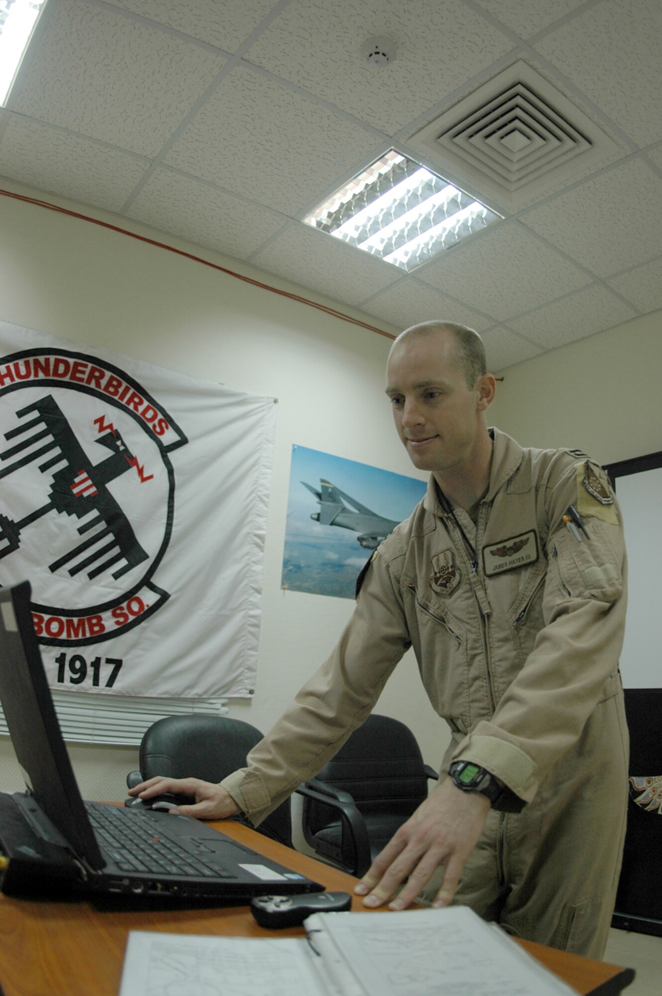 Capt. James Hayes, 34th Expeditionary Bomb Squadron co-pliot, prepares for a close air support mission. CAS requires effective communication between air and ground forces. (U.S. Air Force by Capt. Teresa Sullivan)