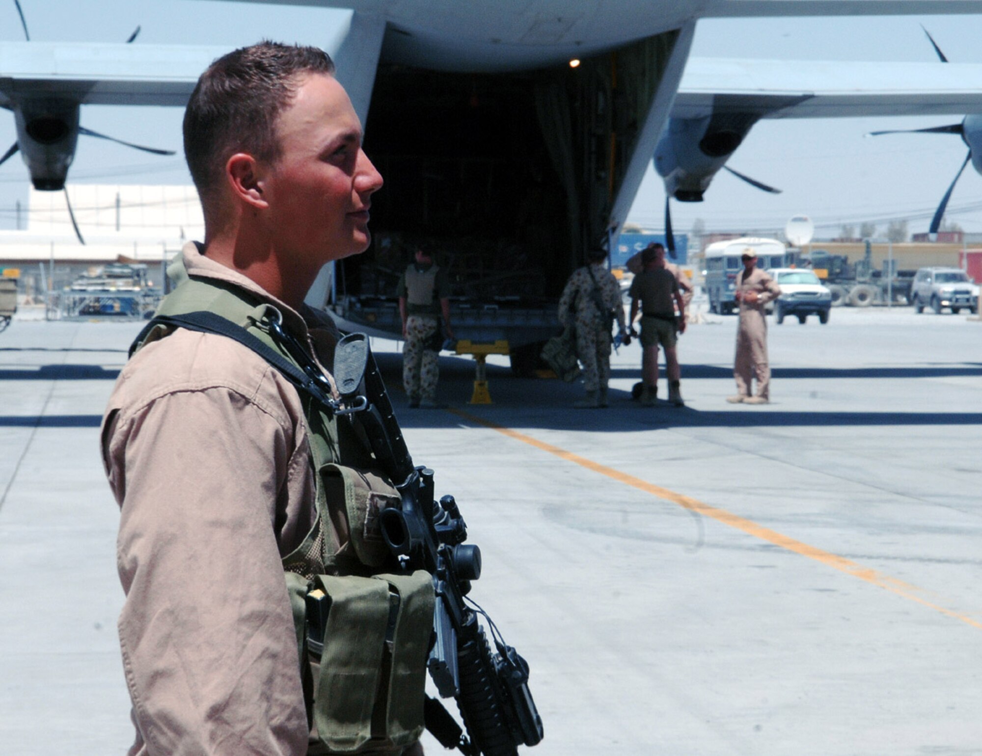 Senior Airman Michael Madden, 455th Expeditionary Security Forces Squadron Fly Away Security Team member, provides flight deck denial and protects the perimeter of aircraft at unsecured locations around Afghanistan. Airman Madden is deployed from Ramstein Air Base, Germany. (photo by Capt. Nora Eyle)