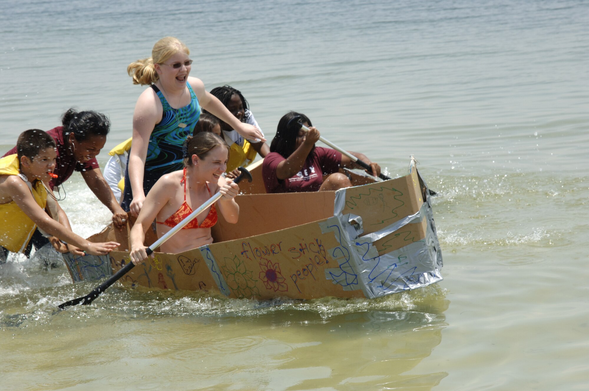 Children enrolled in last weeks Drug Education for Youth program participated in a cardboard boat regata held at the base beach June 13. The program is held each year to educate youth on the dangers of drugs.