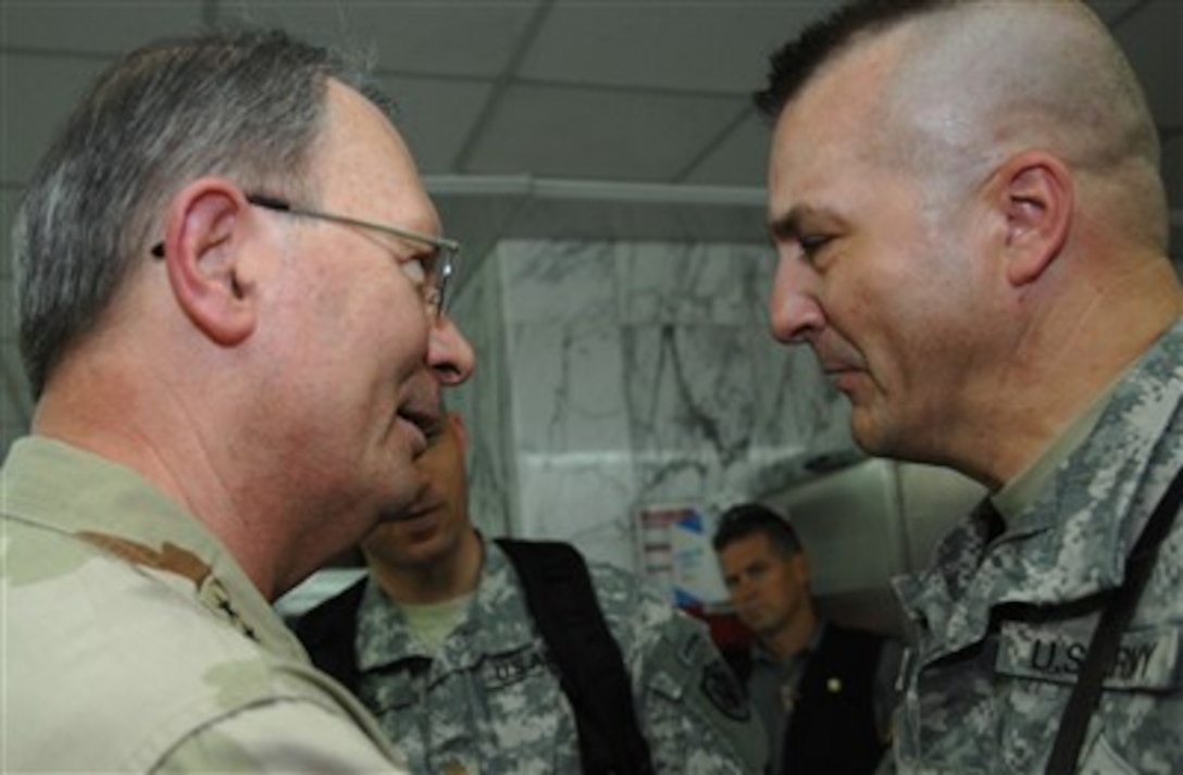 U.S. Navy Adm. Edmund P. Giambastiani, vice chairman of the Joint Chiefs of Staff, meets with the 759th Military Police Battalion commander at the Combat Support Hospital in the International Zone in Baghdad, Iraq, June 21, 2007.