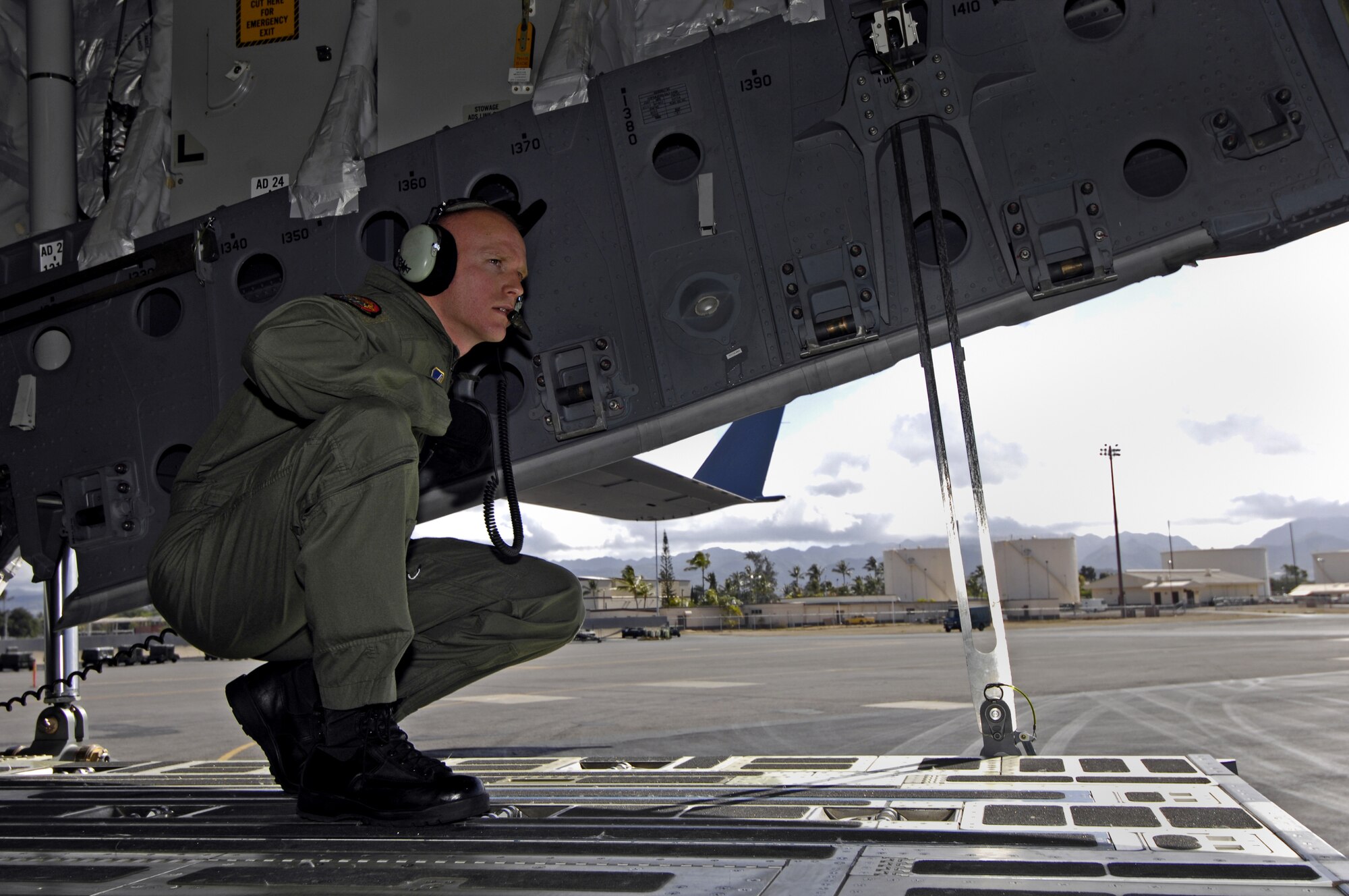 Tech. Sgt. Ansen Lucas backs his C-17 Globemaster III June 22, 2007 at Hickam Air Force Base, Hawaii. Sergeant Lucas, a loadmaster with the 535th Airlift Squadron, is practicing for the upcoming Air Mobility Rodeo. (U.S. Air Force photo/ Tech. Sgt. Shane A. Cuomo)