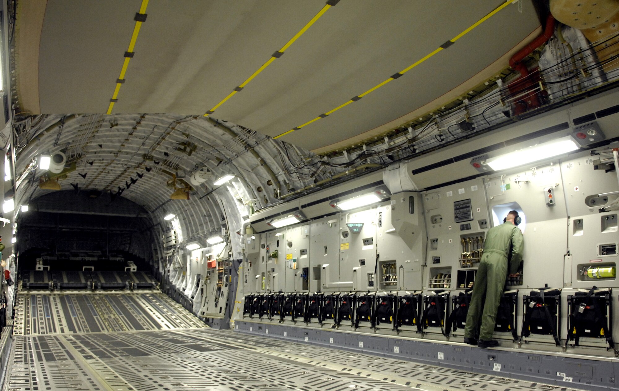 Tech. Sgt. Ansen Lucas conducts an inspection of his C-17 Globemaster III after taking off June 22, 2007 on a refueling training mission from Hickam Air Force Base, Hawaii. A KC-135 Stratotanker from the 909th Air Refueling Squadron, Kadena Air Base Japan is at Hickam practicing with the Globemaster crew from the 535th Airlift Squadron for the Air Mobility Rodeo.  Sergeant Lucas is a loadmaster with the 535th Airlift Squadron. (U.S. Air Force photo/ Tech. Sgt. Shane A. Cuomo) 
