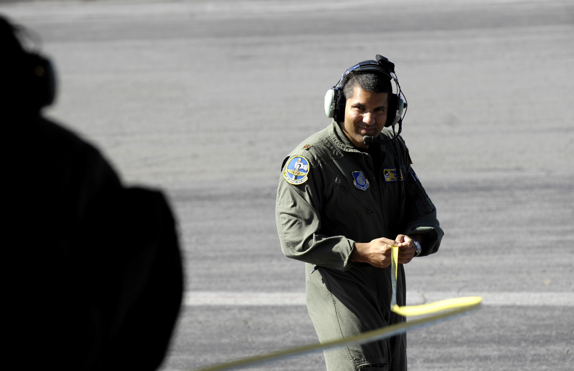 Maj. Bryon Miranda helps Tech. Sgt. Ansen Lucas measure the distance between his C-17 Globemaster III and their target point for stopping June 22, 2007 at Hickam Air Force Base Hawaii. The 535th Airlift Squadron is practicing for the upcoming Air Mobility Rodeo. (U.S. Air Force photo/ Tech. Sgt. Shane A. Cuomo)