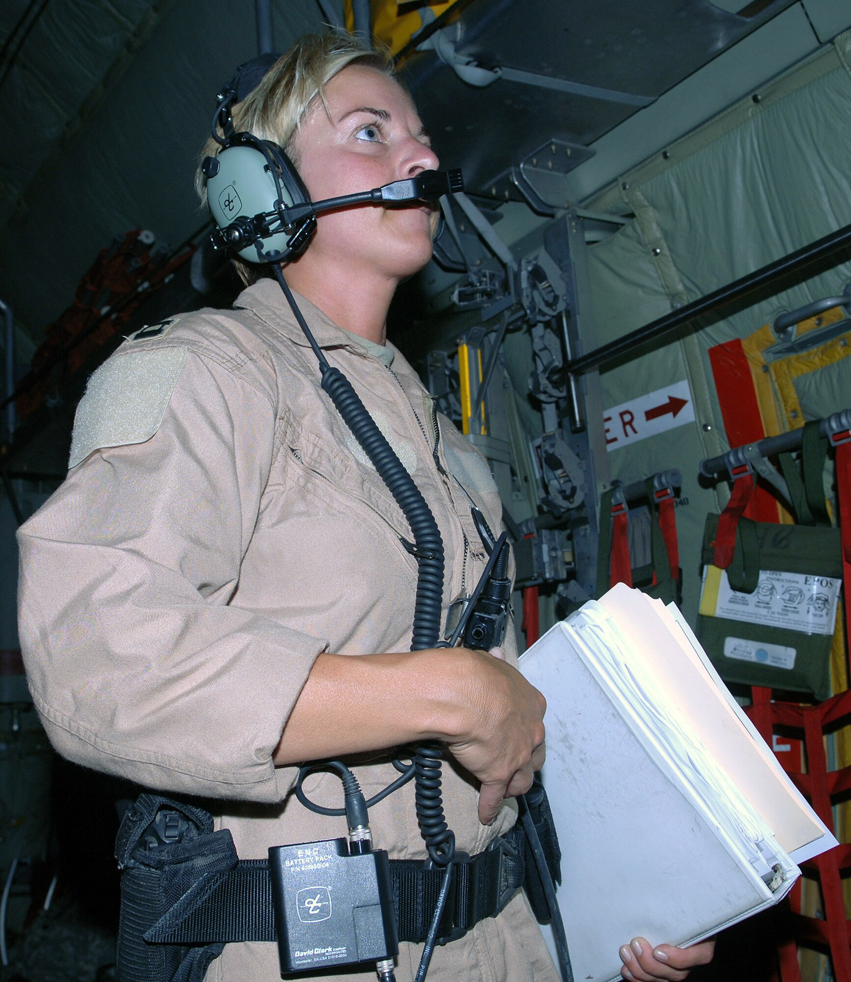 Capt. Michelle Mulberry, 455th Expeditionary Aeromedical Evacuation Flight nurse, speaks to the C-130 aircrew prior to receiving patients on an aeromedical evacuation mission from Bagram Airfield, Afghanistan. Capt. Mulberry is deployed from the Wyoming Air National Guard's 187th Aeromedical Evacuation Squadron, Cheyenne, Wyo. (photo by Staff Sgt. Craig Seals)