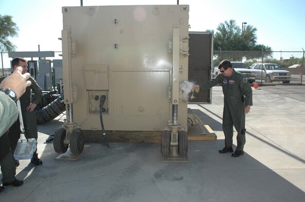 The Arizona Air National Guard's Predator Ground Control Station was christened, June 21 at 8 a.m. by Maj. Gen. Michael J. Shira, assistant adjutant general and commander, Joint Force Headquarters, Arizona Air National Guard, Phoenix, Arizona.  The GCS, which can be most closely compared to the cockpit of an aircraft will start operations in the next few weeks.  Arizona ANG aircrews trained to fly the Predator will fly combat missions 24 hours a day, seven days a week in support of our troops deployed in theater.  Although pilots and sensors controlling the aircraft will be right here at Davis-Monthan AFB, satellite technology allows the aircraft they are flying to physically be overseas supporting current combat operations.  The main mission of the Predator is to provide Intelligence, Surveillance and Reconnaissance (ISR), but often times falls into the role of Close Air Support (CAS).  In the CAS role, the Predator either works closely with other CAS assets, such as the A-10, or, in some cases provides firepower of it's own with the use of ROVER technology and Hellfire missiles.  The Arizona National Guard has been working tirelessly for nearly two years to make this mission a reality.  The combat theater's requests for the Predator are well above what can be provided at the current operations level and hopefully this is just the beginning of the Guard's role in helping to meet the needs of those in harm's way. The Arizona ANG would like to pass their thanks to the many units on Davis-Monthan who went above and beyond to provide the support needed to stand up this brand new combat mission squadron. (U.S. Air Force photo by Staff Sgt. Jake Richmond)