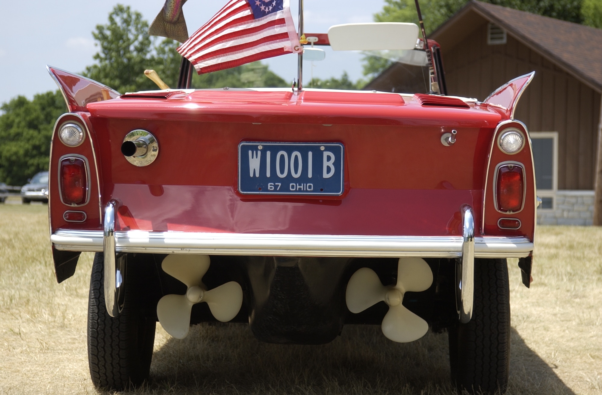 Twin propellers and a 40-horsepower Triumph Herald engine can propel the Amphicar at 7 knots in the water and 70 miles-an-hour on the road. The underside of the car resembles a boat hull. (Air Force photo/Staff Sgt. Andrew Hafey)