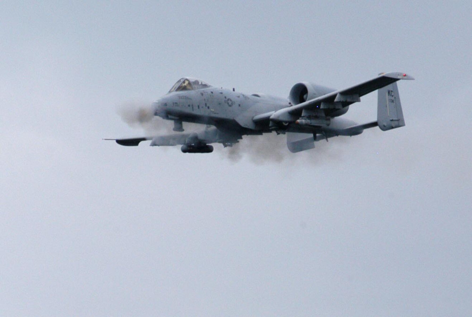 Maj. Aaron Linderman, an A-10 pilot from the 303rd Fighter Squadron, fires the 30-milimeter gun from an A-10 Thunderbolt II during a strafing run at Cannon Range near Ft. Leonard Wood, Mo., June 20, 2007.  The 303rd FS is part of the Air Force Reserve's 442nd Fighter Wing based at Whiteman Air Force Base, Mo.  The wing flies to Cannon Range virtually every day to ensure its pilots stay proficient in the close air support mission the A-10 was designed for. Cannon Range, managed by the Missouri Air National Guard's 131st Fighter Wing, plays a crucial role in the training and readiness of pilots from Reserve, Guard and active-duty units from all over the United States.  (U.S. Air Force photo/Maj. David Kurle) 